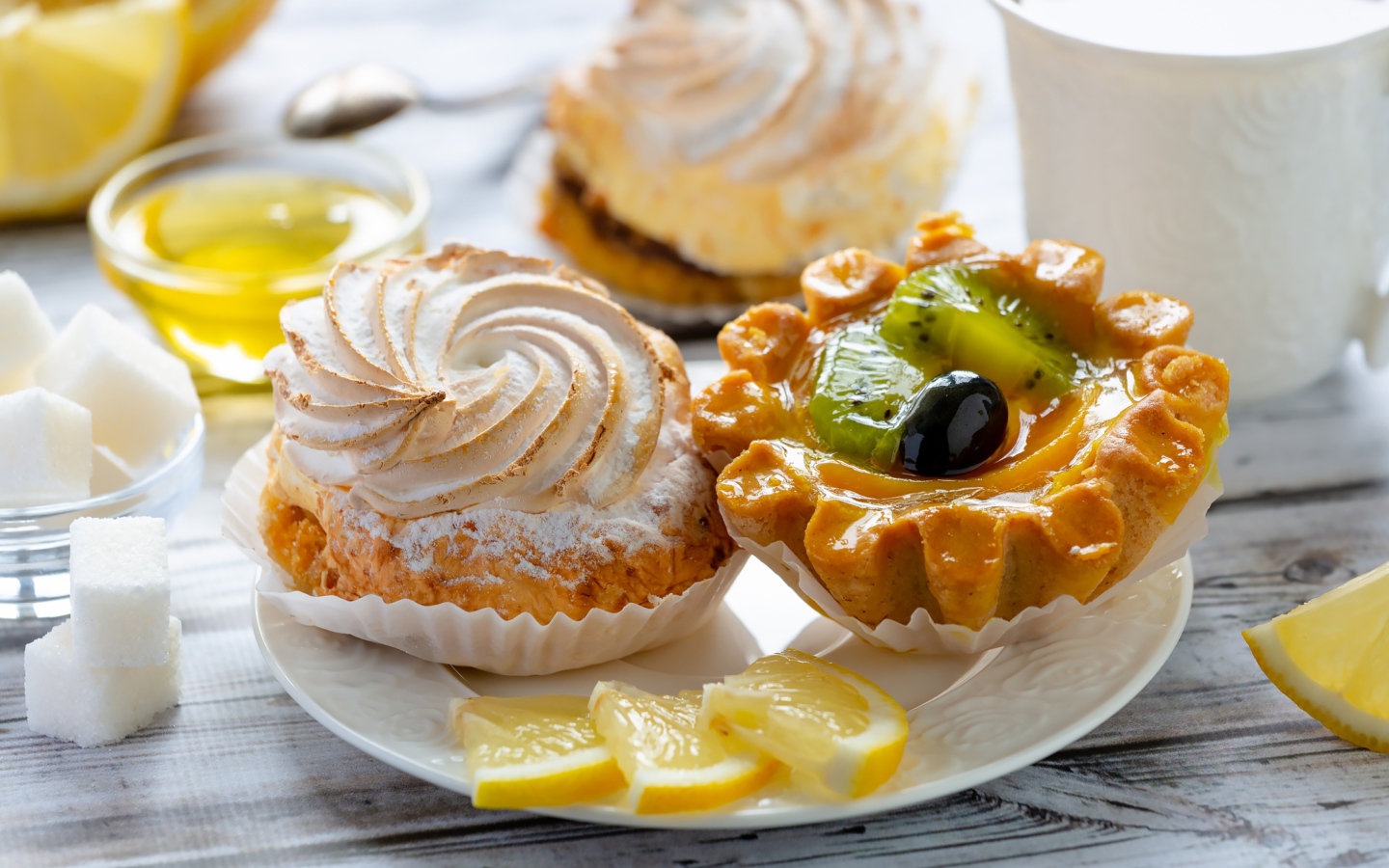 Tasty delicious pastries on a plate with lemon