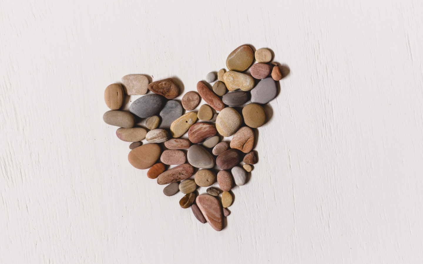 Heart made of stones on a white background