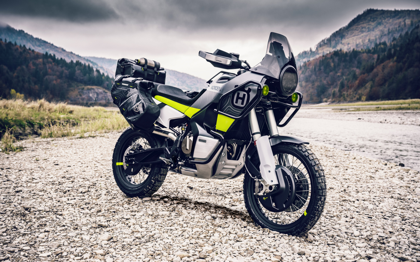 Husqvarna Norden 901 motorcycle on a background of mountains
