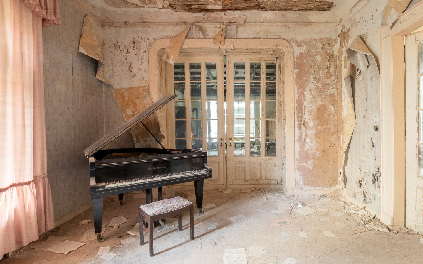 Old abandoned apartment with a grand piano