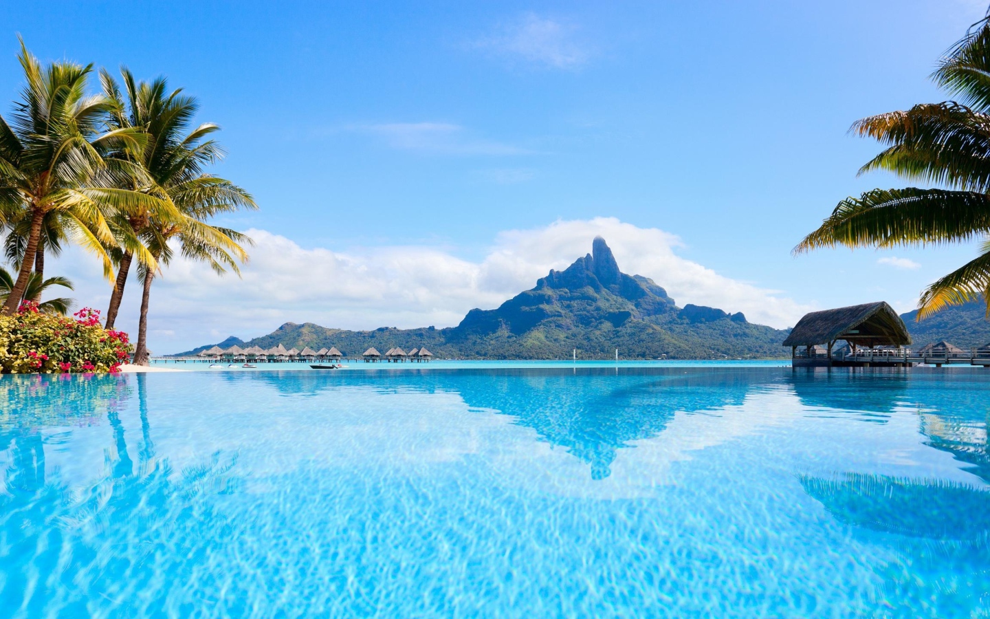 View of the blue water of Bora Bora island in the background of the mountain
