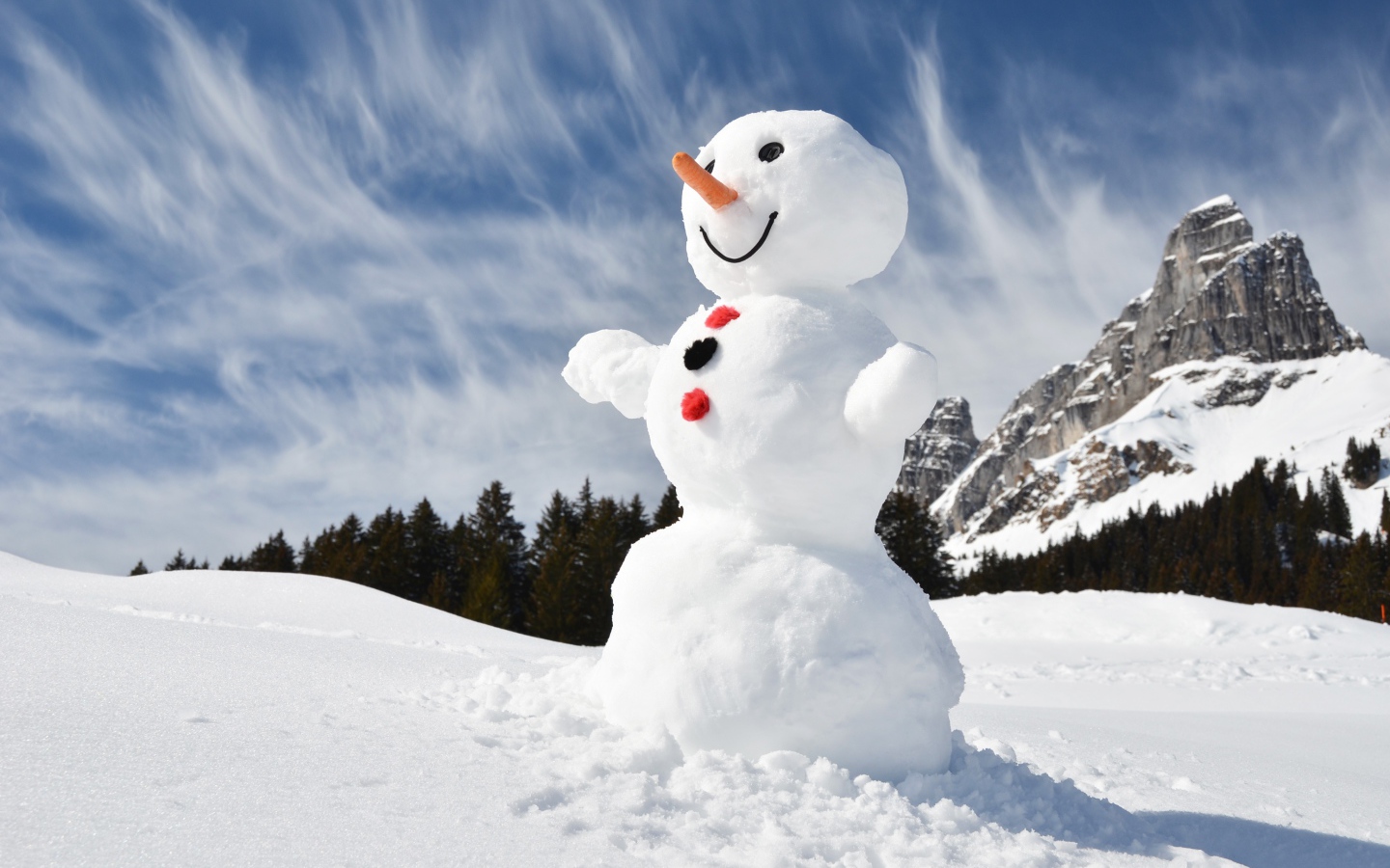 Big snowman in the mountains under the blue sky