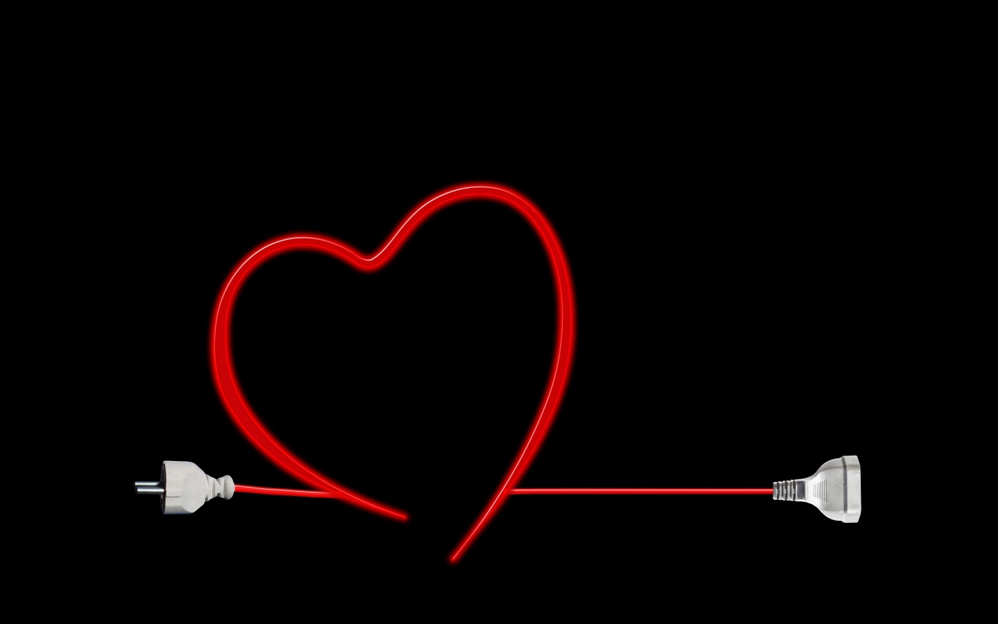 Красное сердце из провода на черном фоне