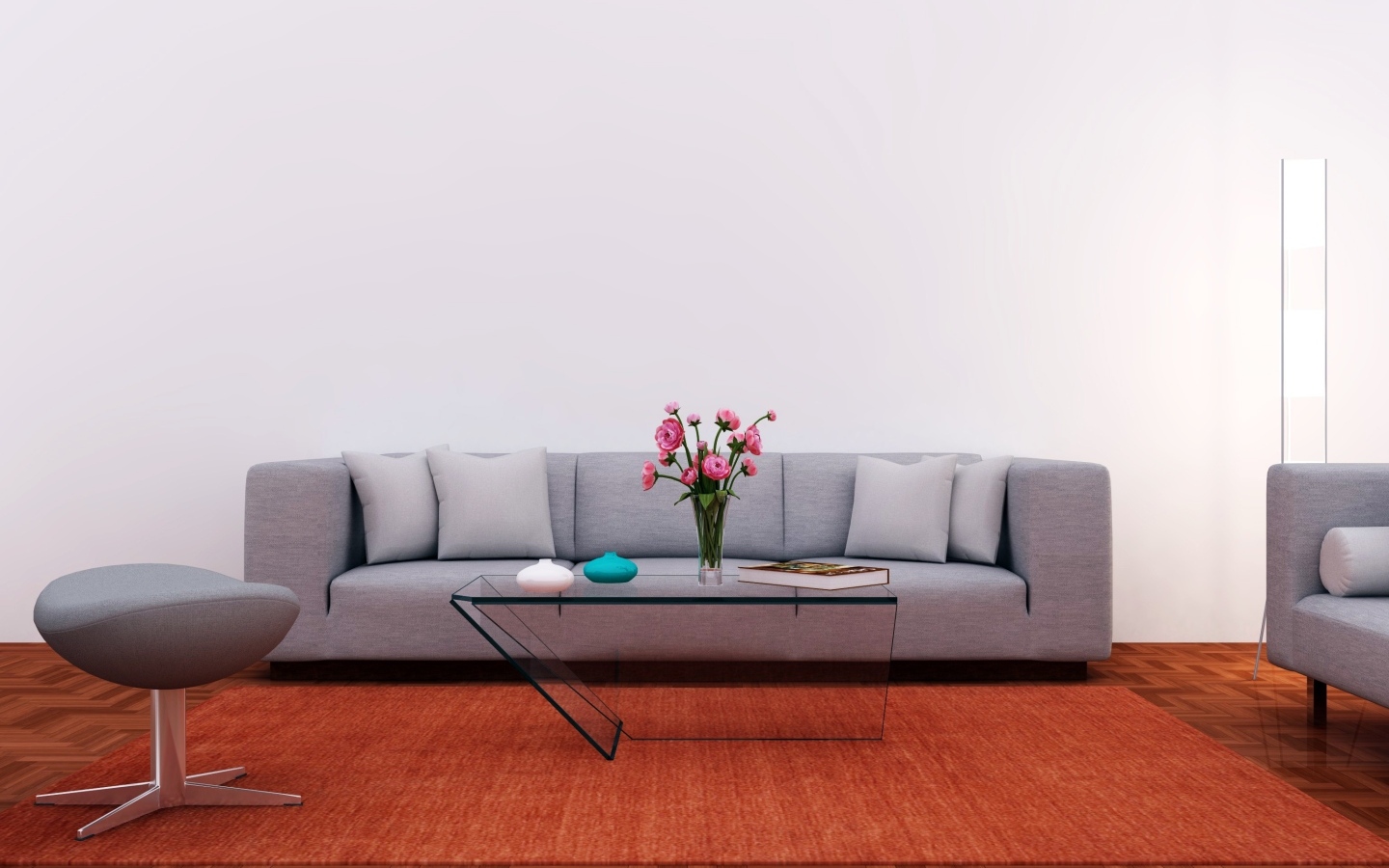 Большой серый диван в комнате с серой стеной