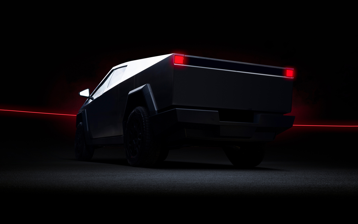 Вид сзади на автомобиль Tesla Cybertruck Dark