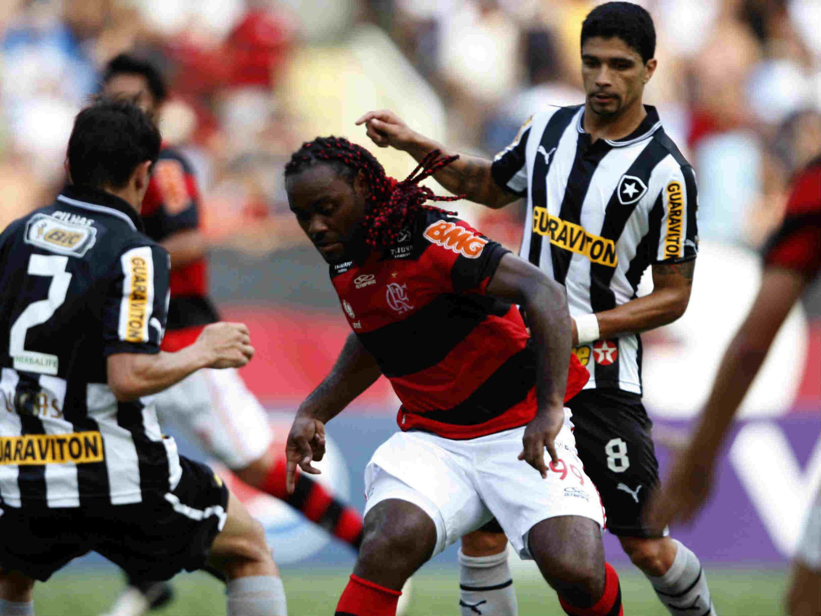 The player of Shandong Luneng Vagner battling for the ball