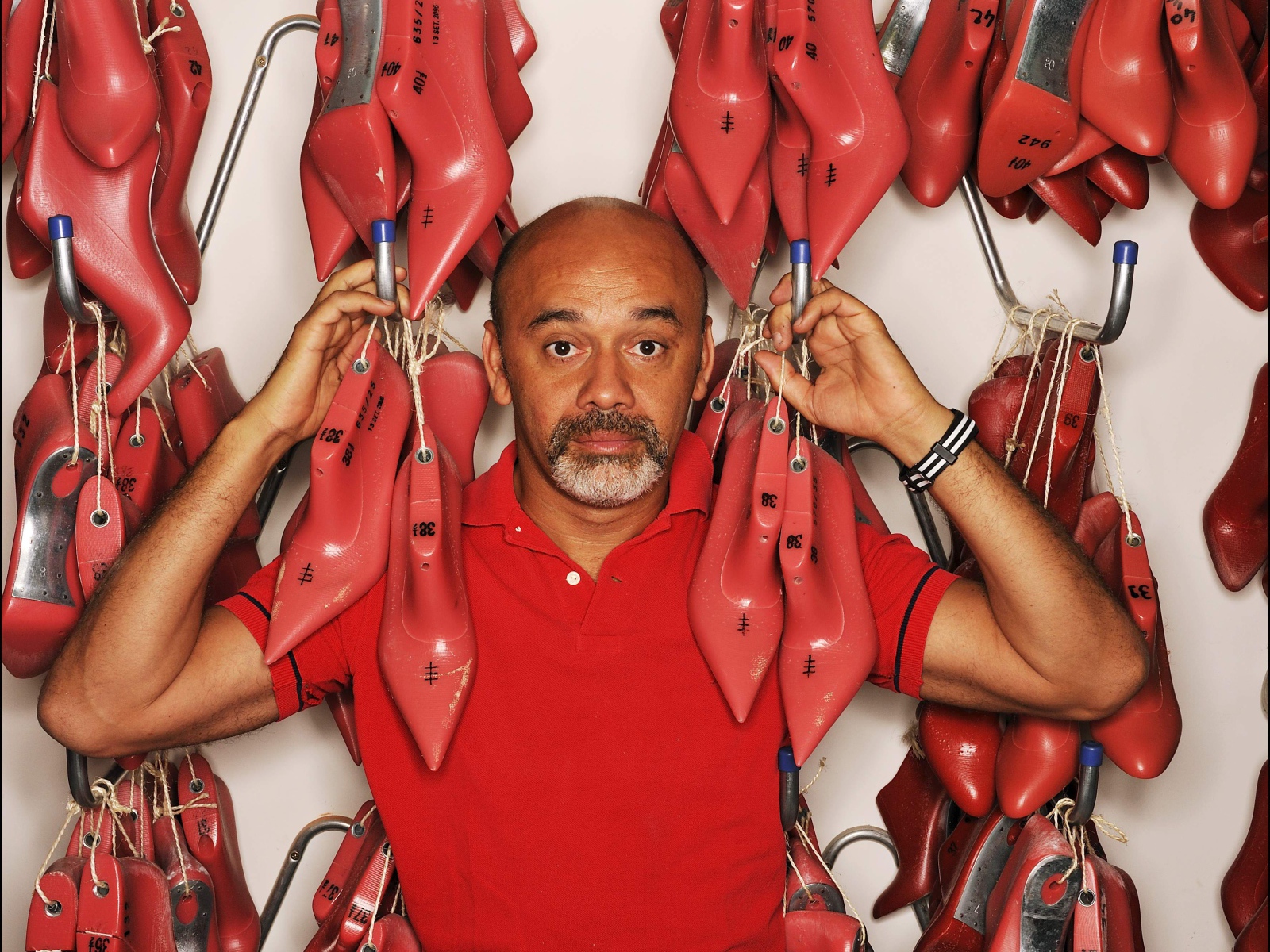 Известный модельер Christian Louboutin
