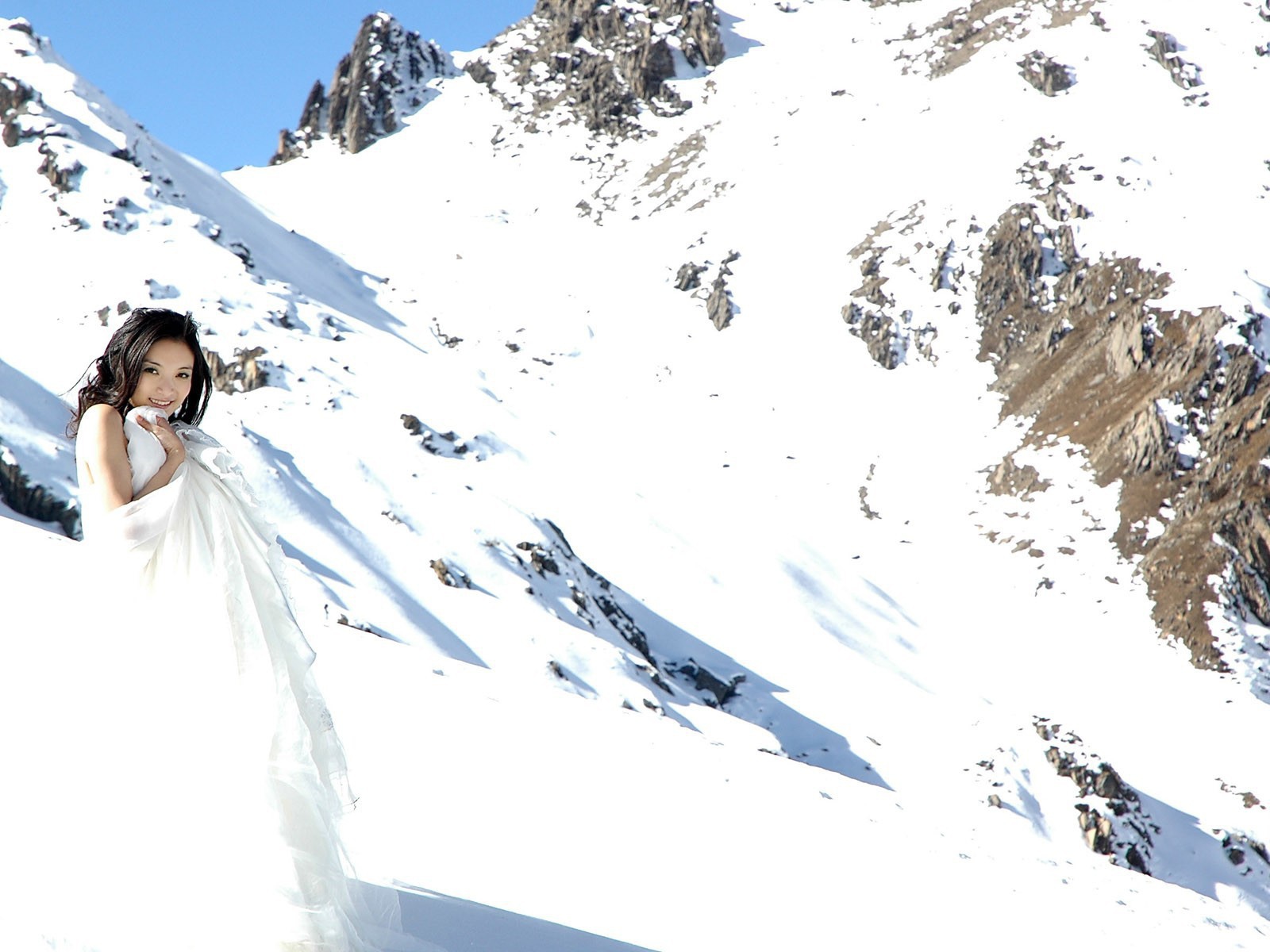 The bride in the snowy mountains