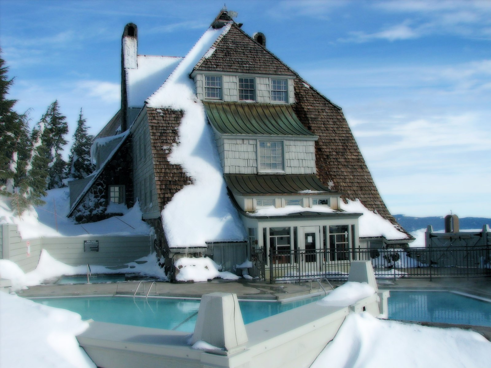 	   Snow-covered house with swimming pool