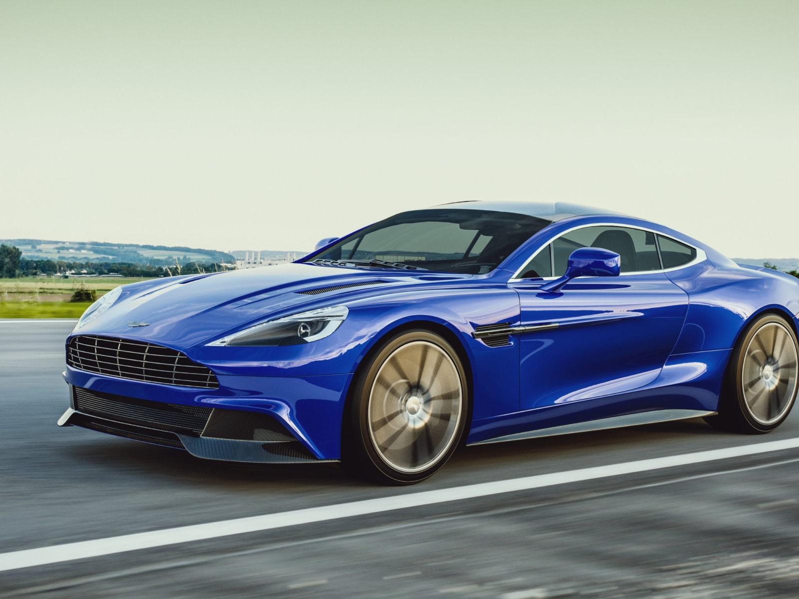 Синий спортивный автомобиль Aston Martin