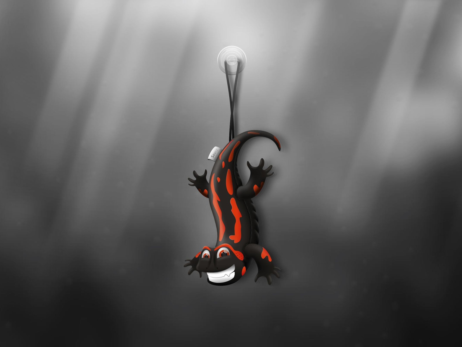 Ящерица игрушка, серый фон