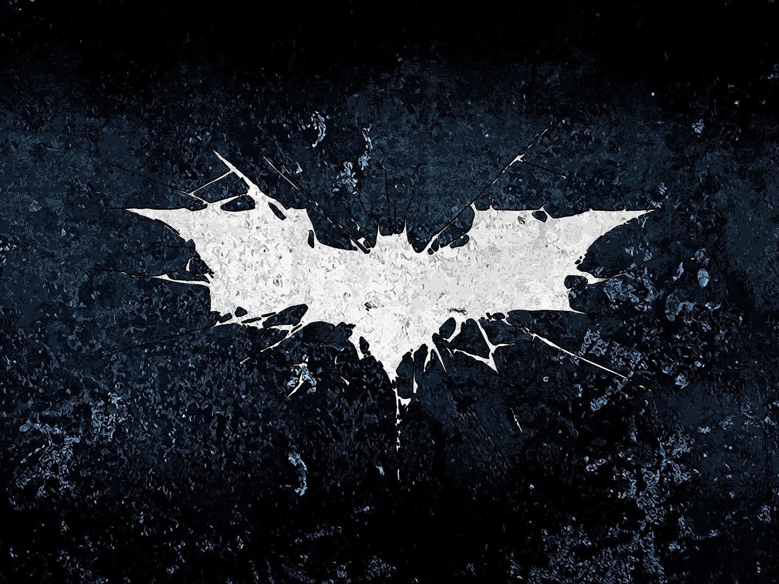 Белый символ летучей мыши на черном фоне