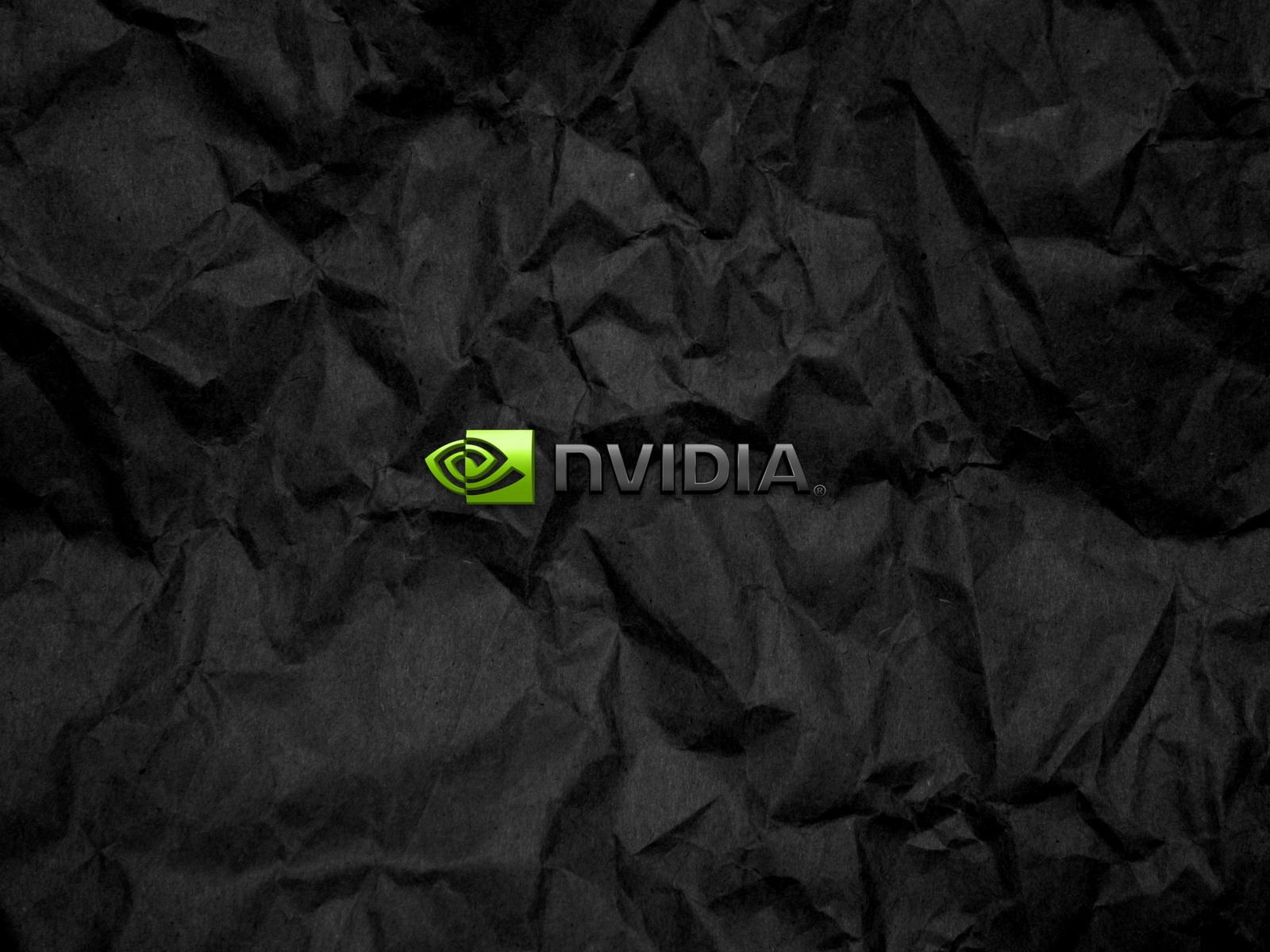 Символика Nvidia на мятой черной бумаге