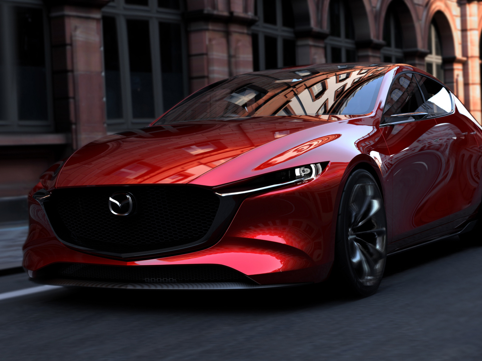 Красный автомобиль Mazda Kai на улицах города