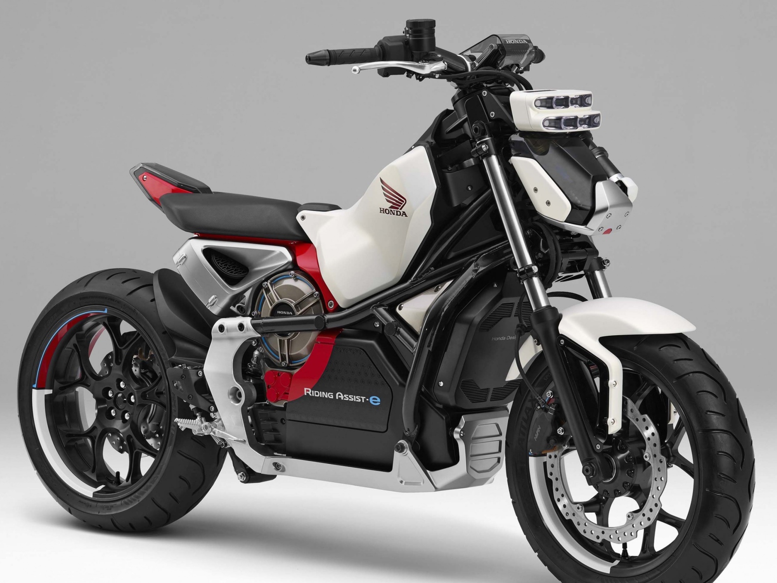 Fast motorcycle Honda Riding Assist-e Concept on a gray background