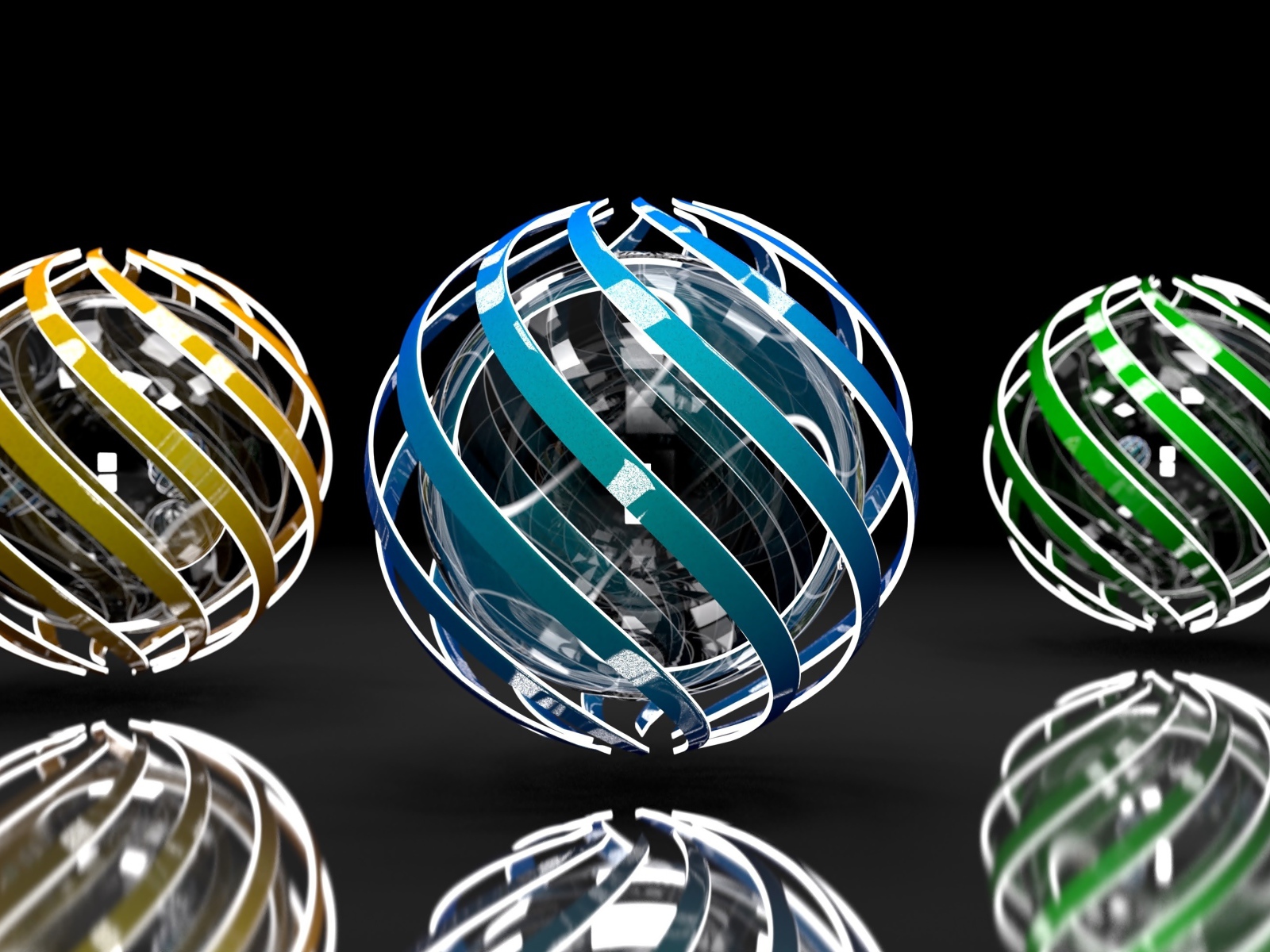 Три разноцветные сферы на сером фоне