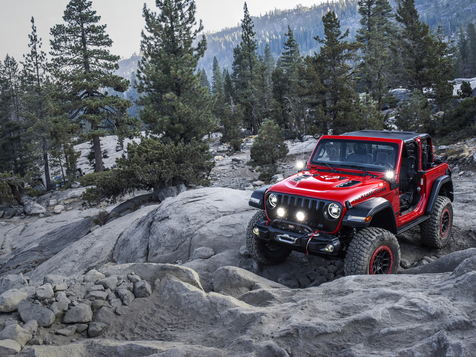 Красный внедорожник  Jeep Wrangler With Mopar, 2018 года в горах 