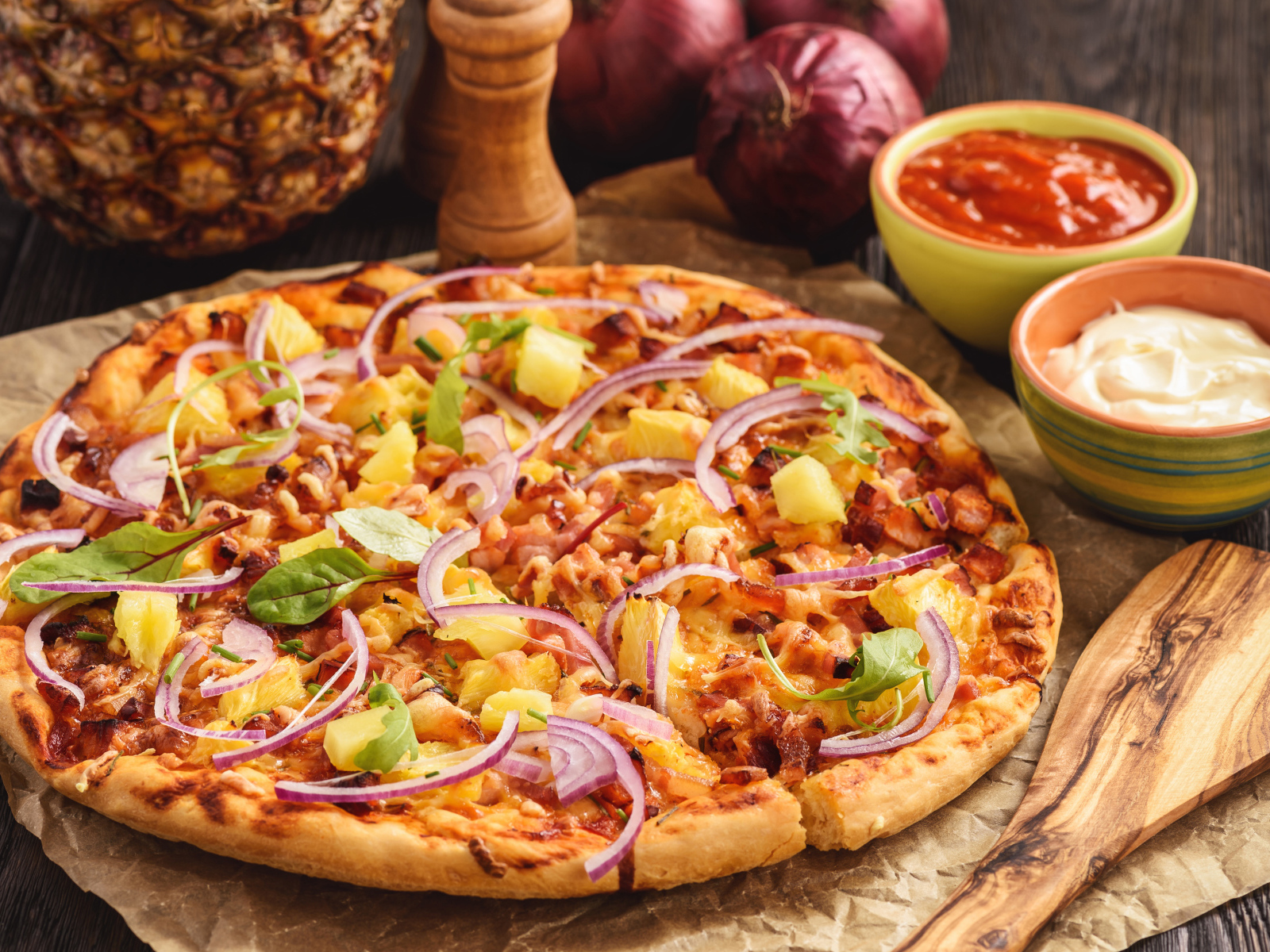 Pizza With Pineapple And Onion On A Table With Sauce Desktop
