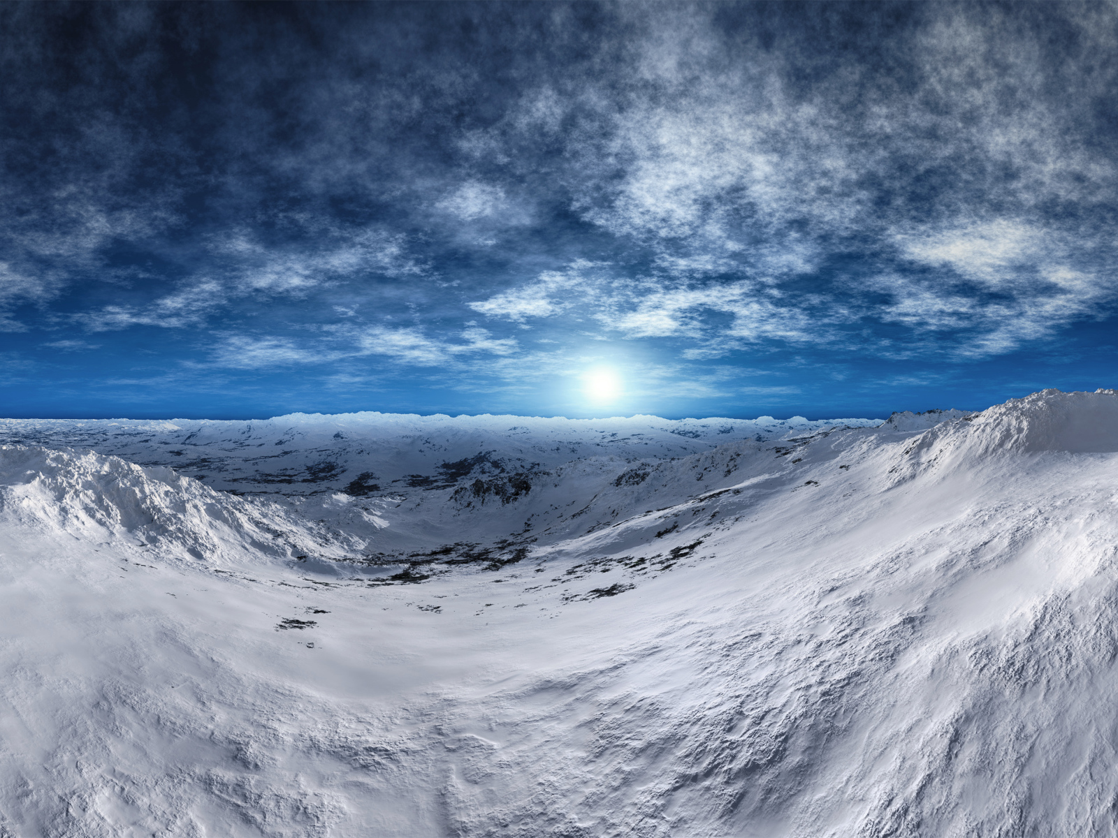 Snow-covered mountain slopes under a beautiful blue sky