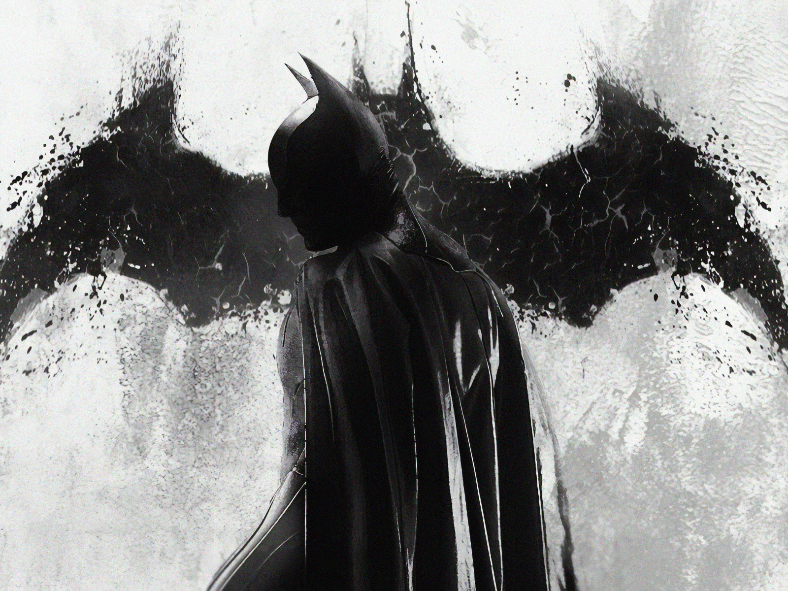 Бэтмен на фоне рисунка летучей мыши на стене