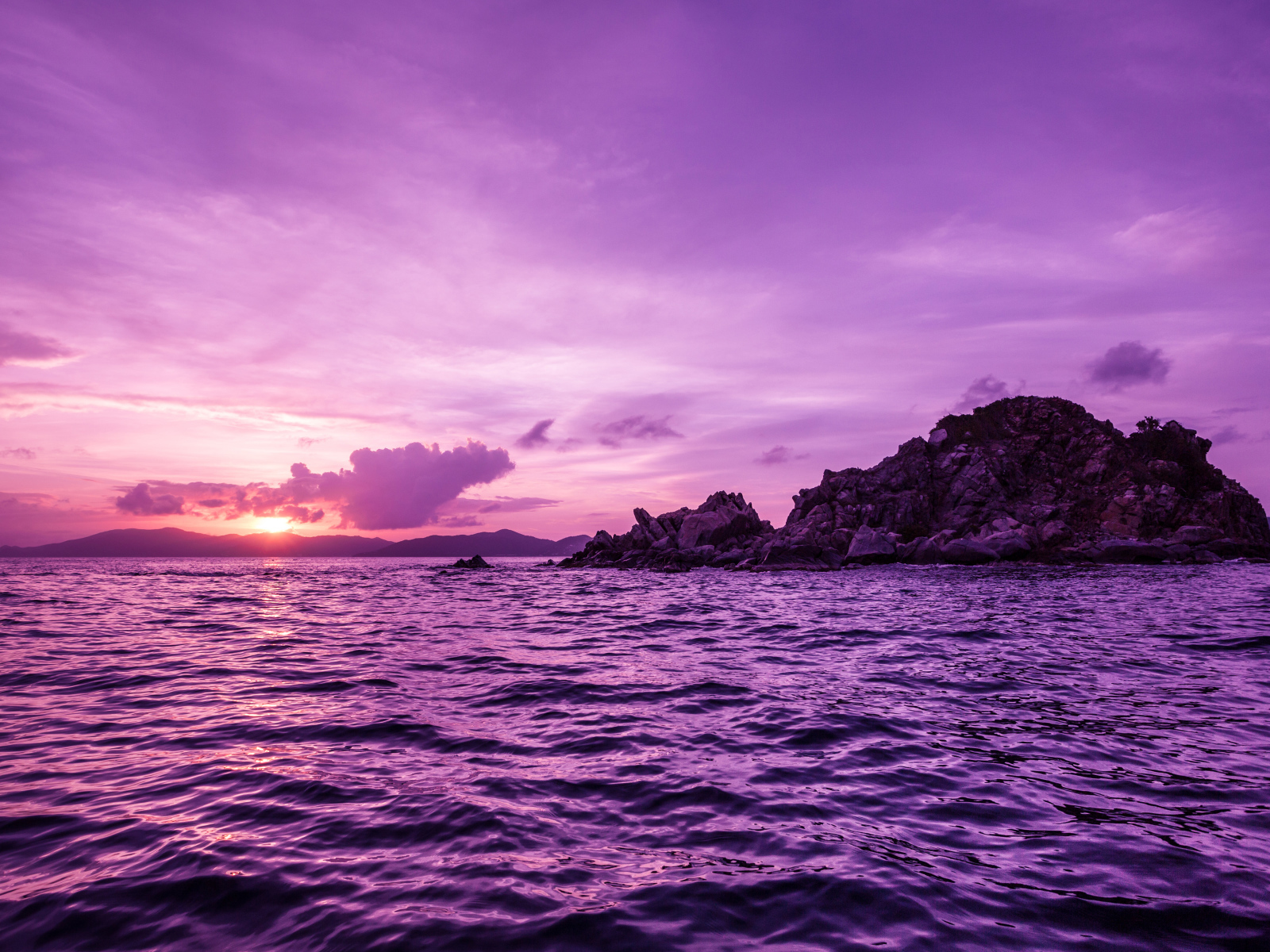 Water in the sea on a background of purple sunset