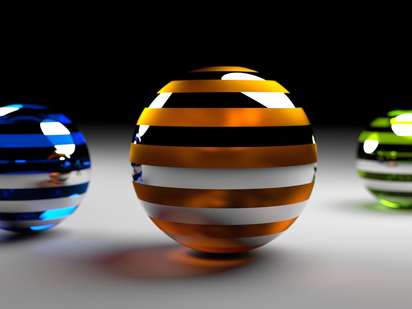 Разноцветные 3д шары на серой поверхности 