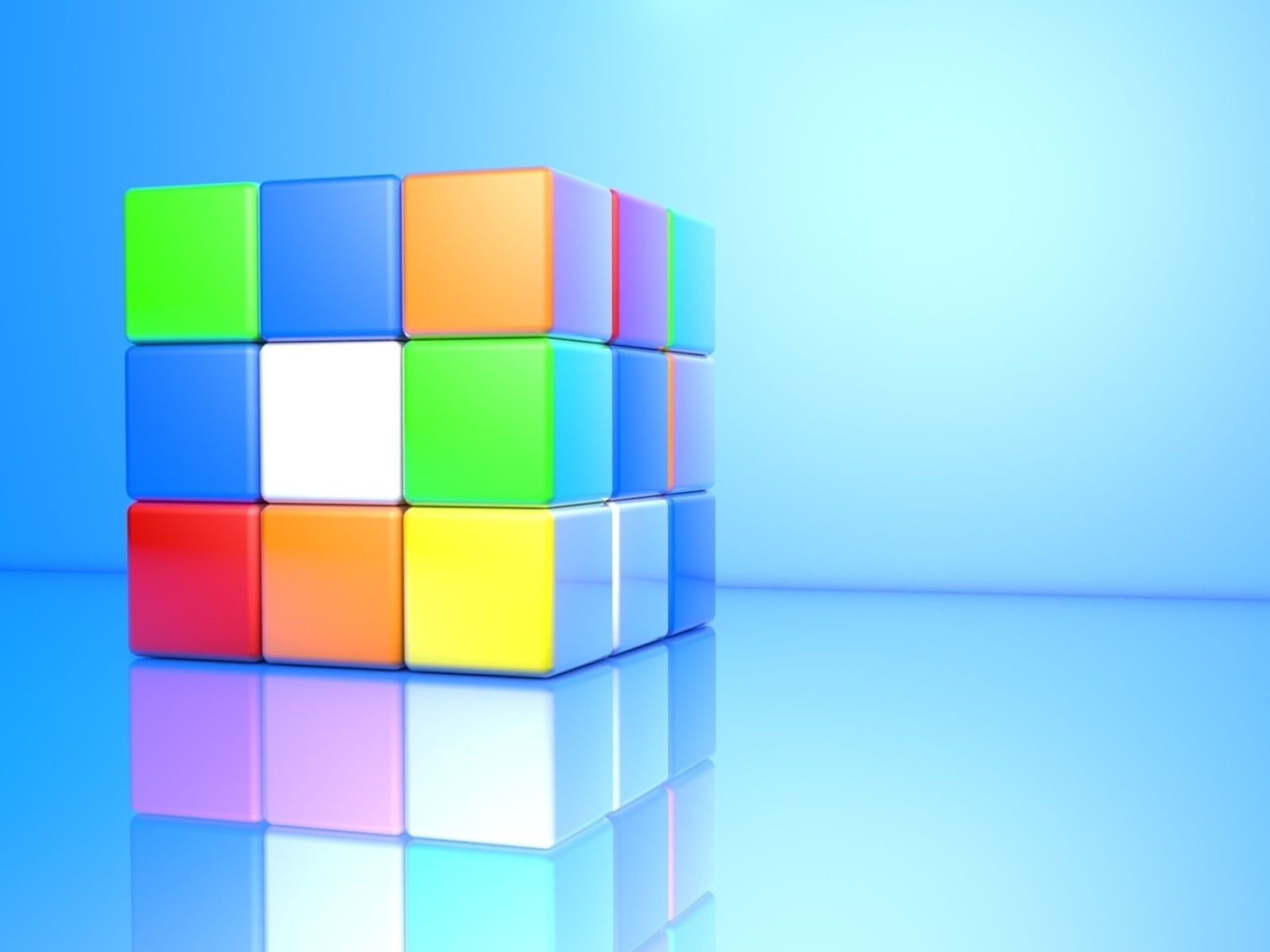 Разноцветный кубик Рубика на голубом фоне 3д графика