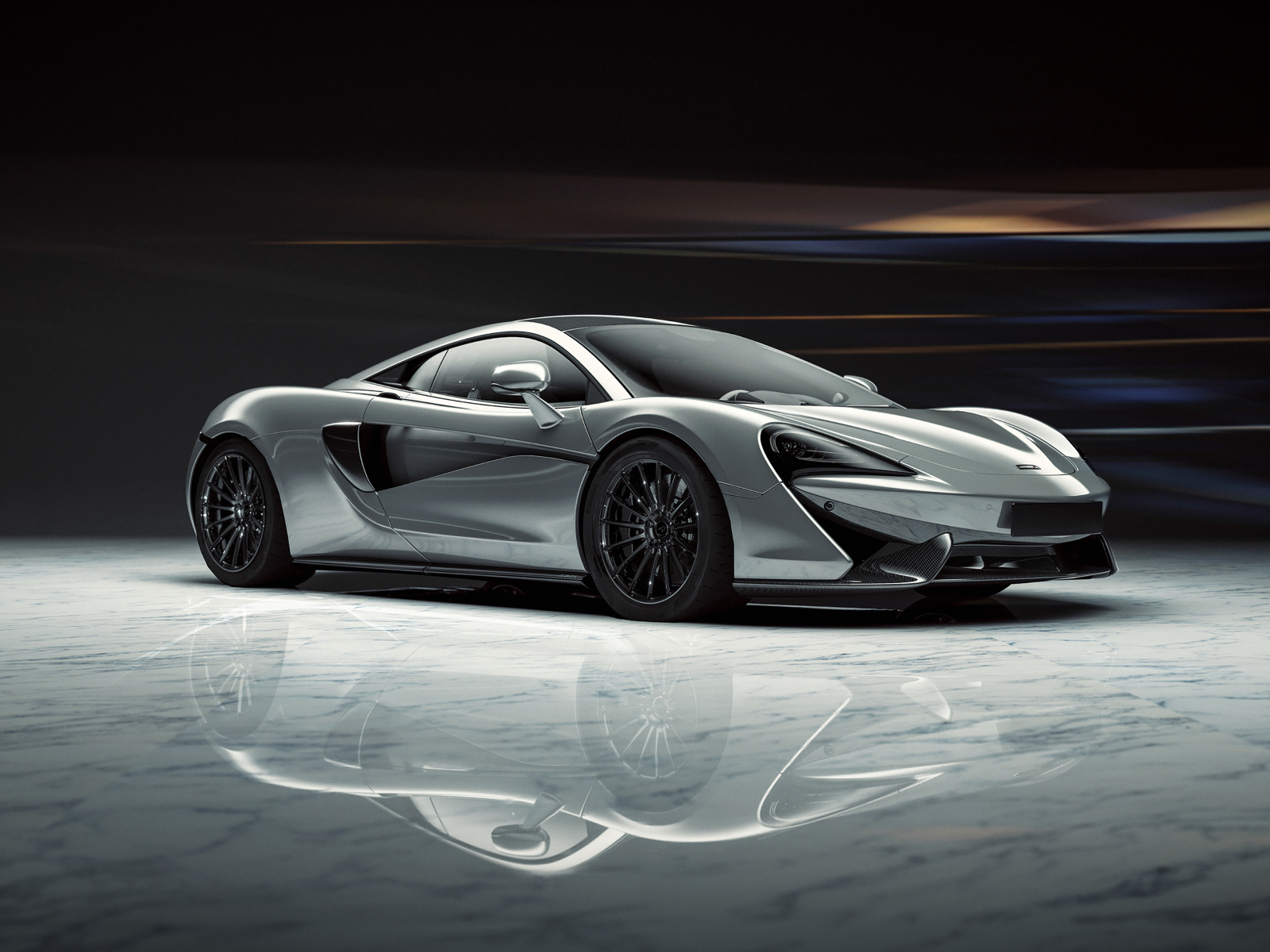Серый спортивный автомобиль McLaren 520S 