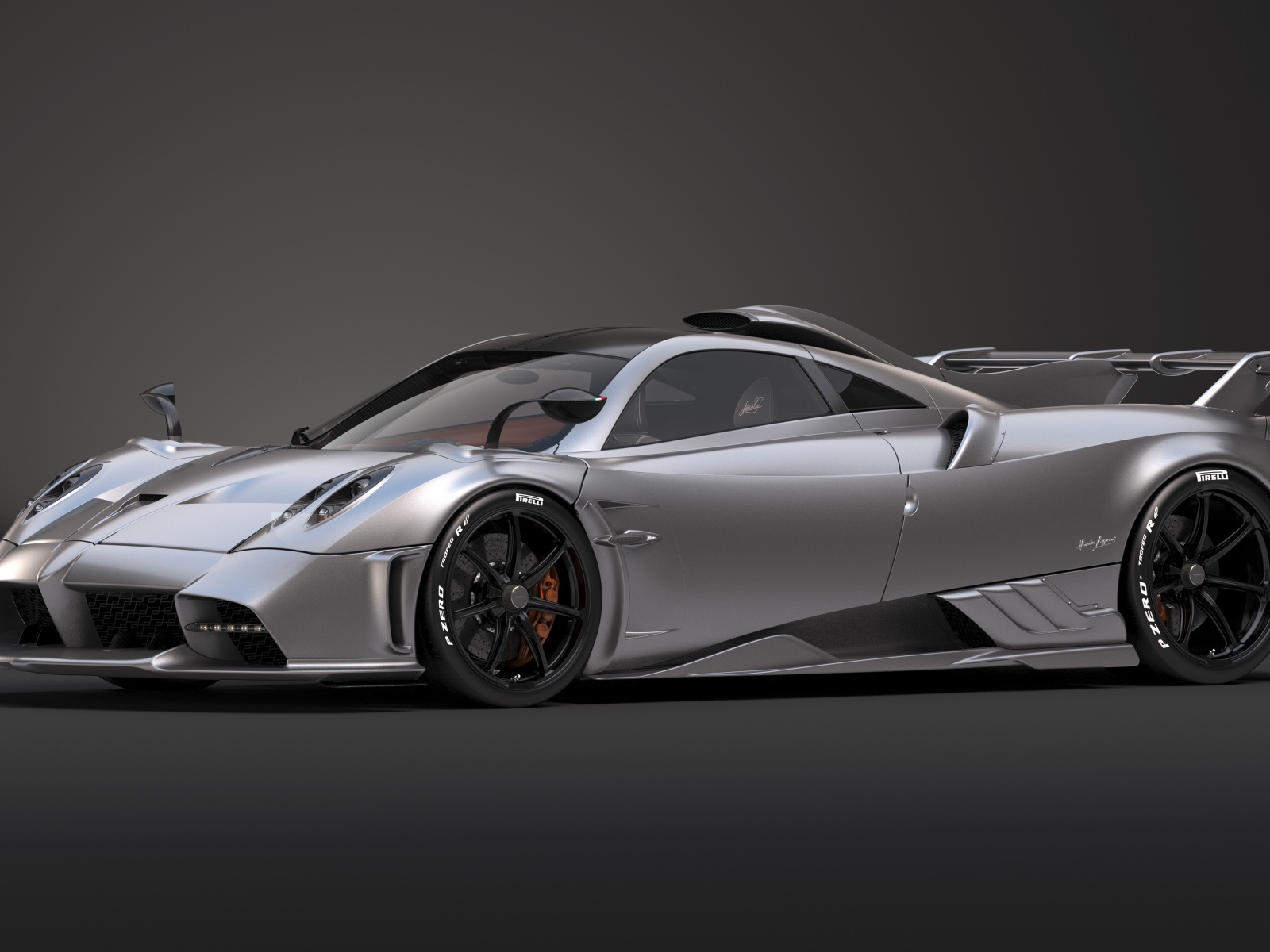 Серебристый автомобиль Pagani Imola 2020 года на сером фоне