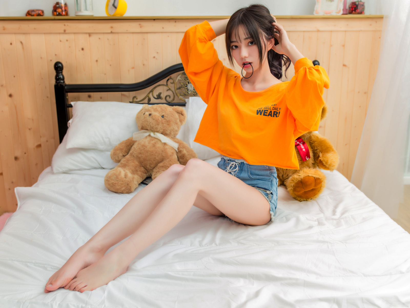 Asian girl on the bed with toys