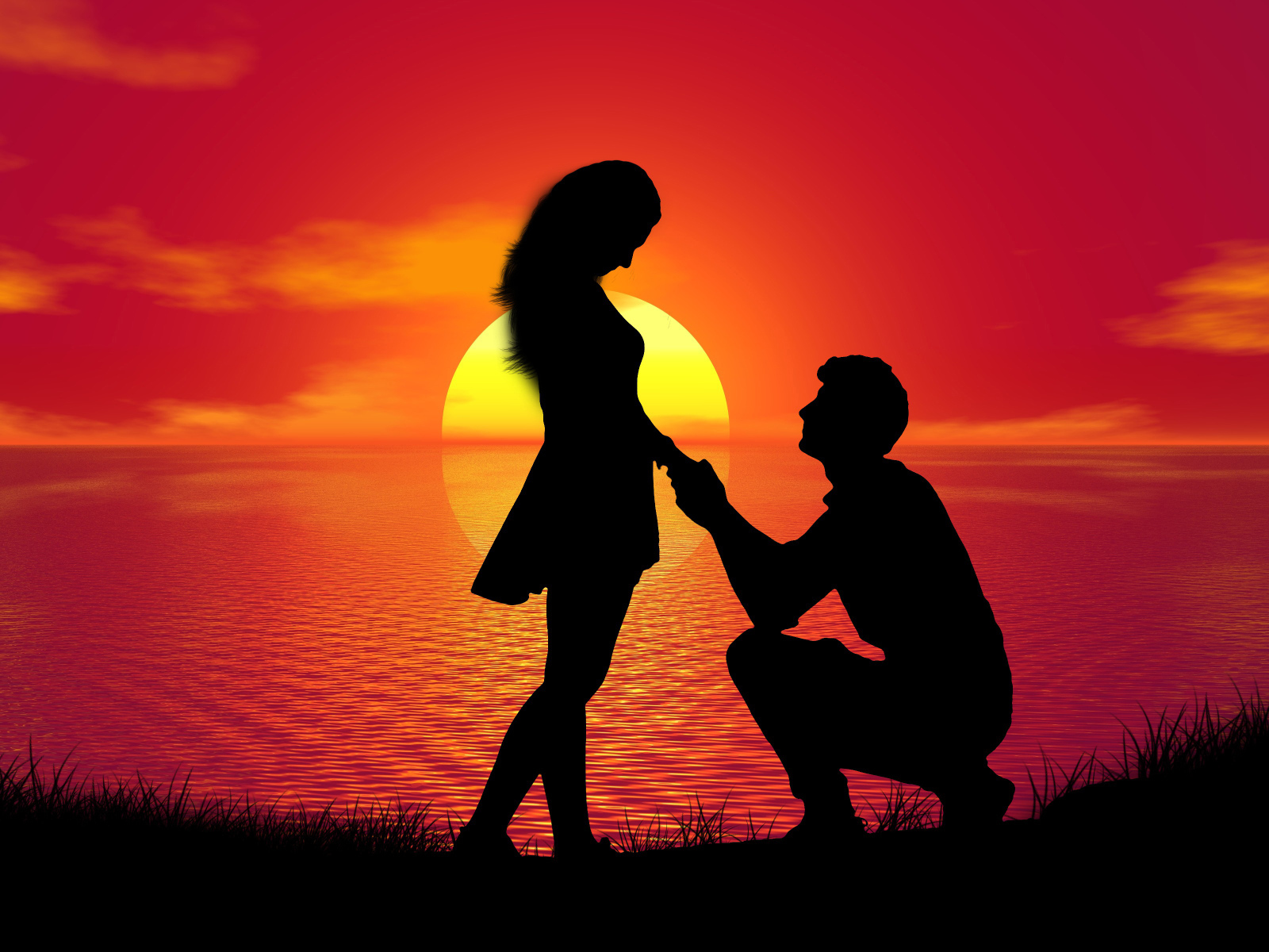 Парень делает девушке предложение на фоне заката у моря