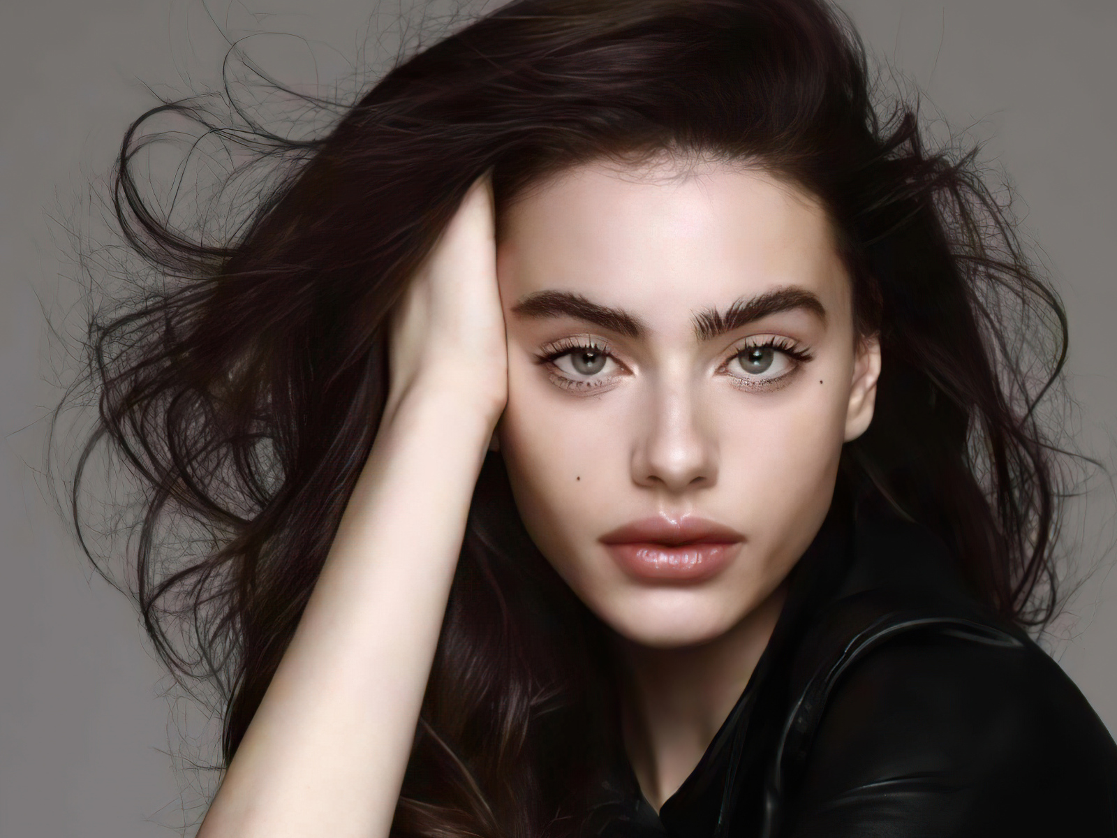 Israeli model Yael Shelbia on a gray background