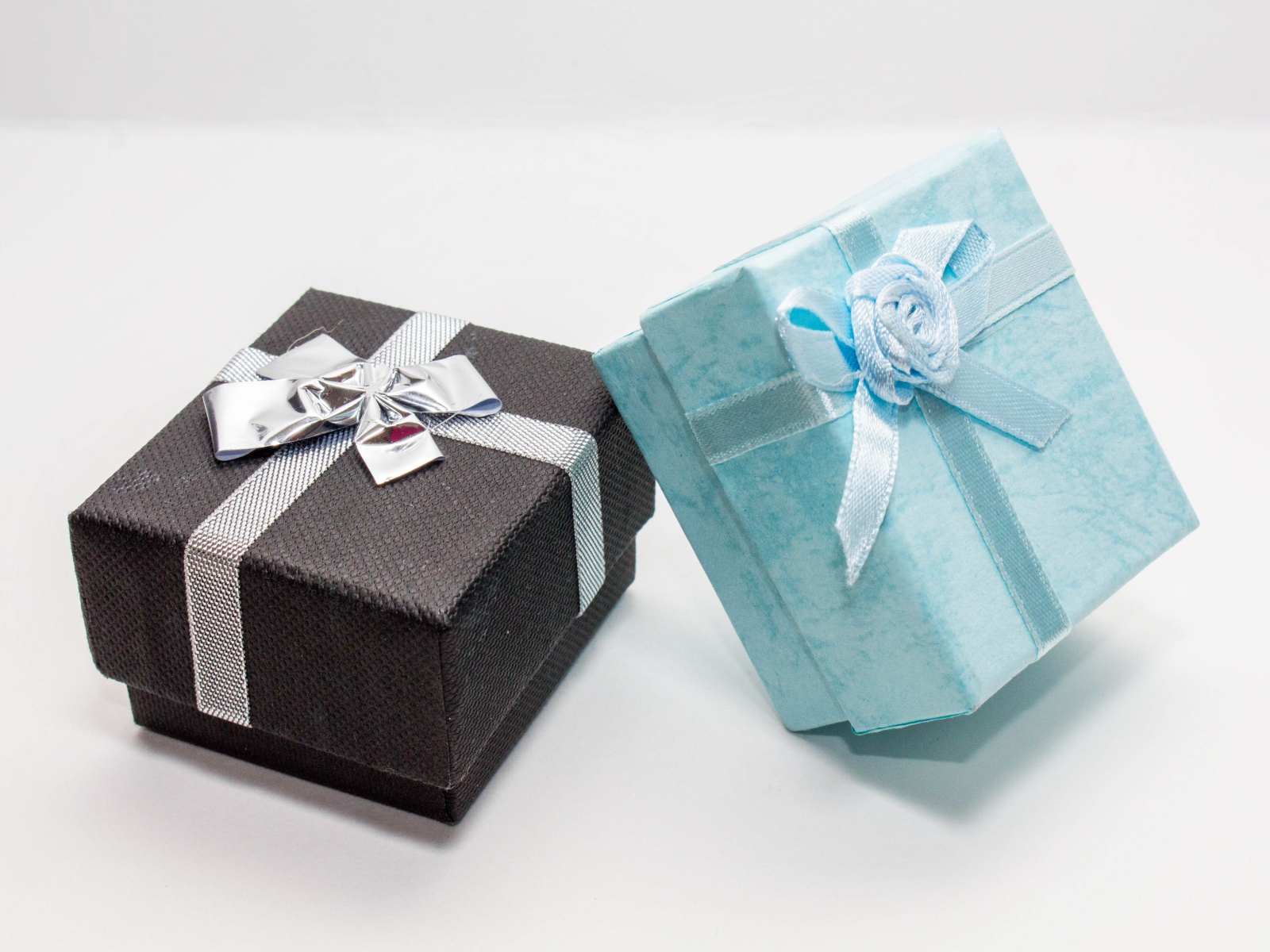 Two boxes with gifts on a gray background