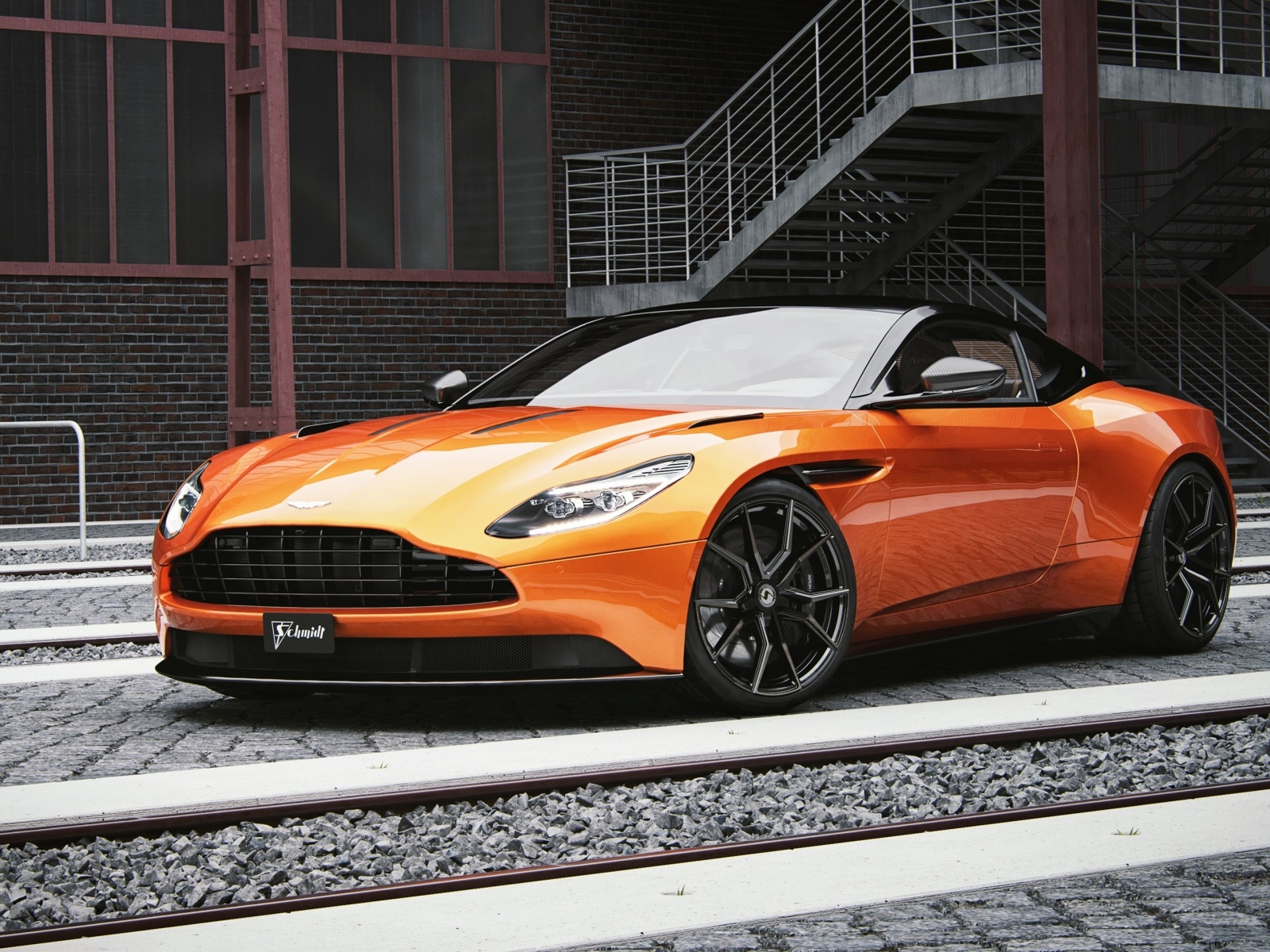 Оранжевый автомобиль Aston Martin DB11