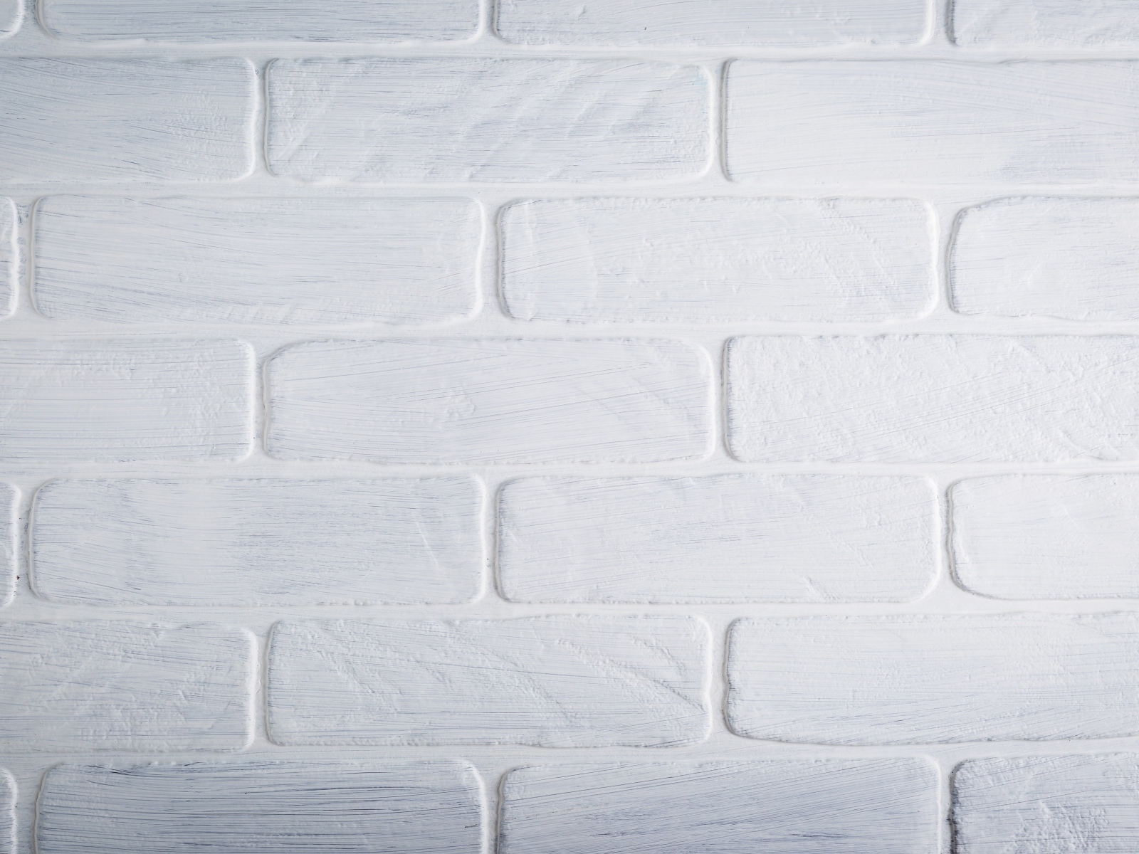 Белая кирпичная стена крупным планом
