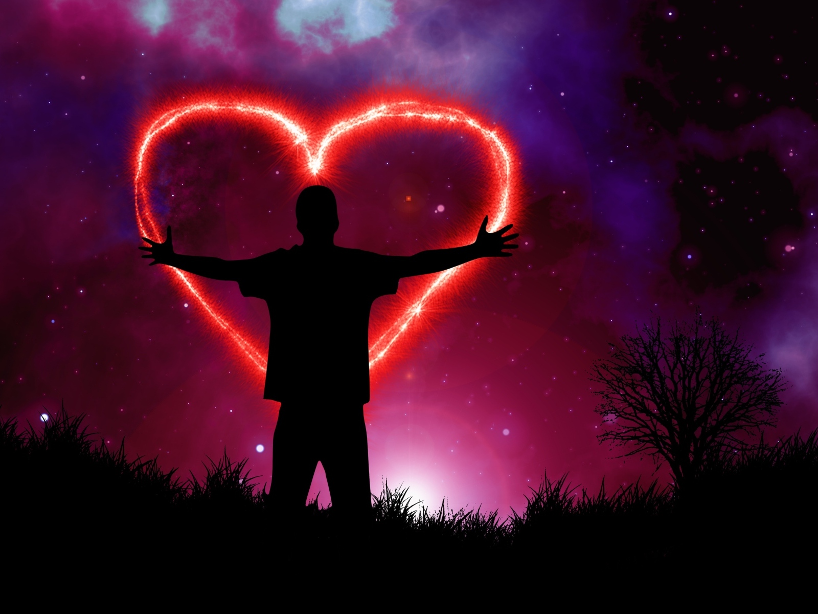 Мужчина рисует красное сердце в ночном небе