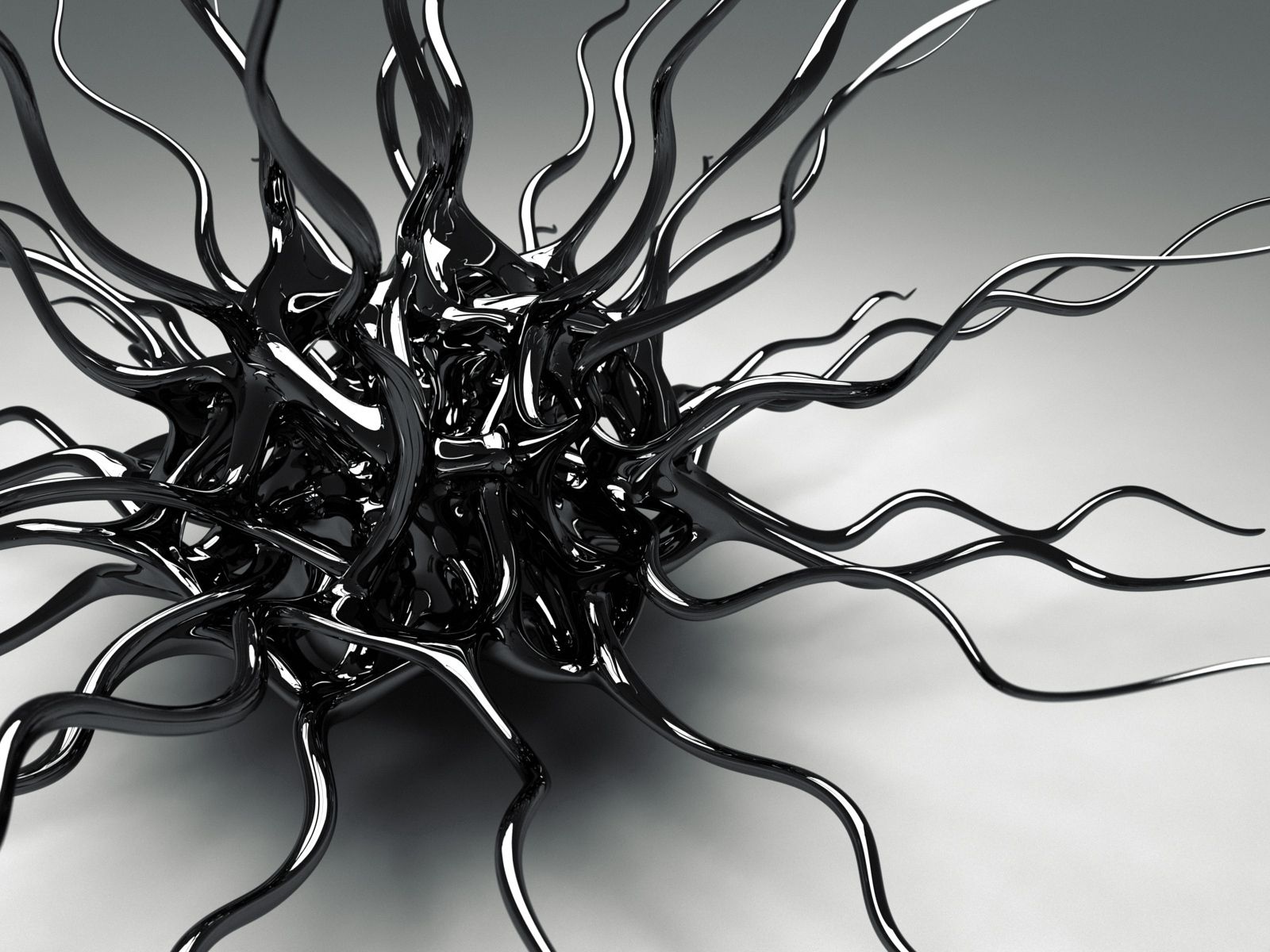 Черный металлический сплав на сером фоне