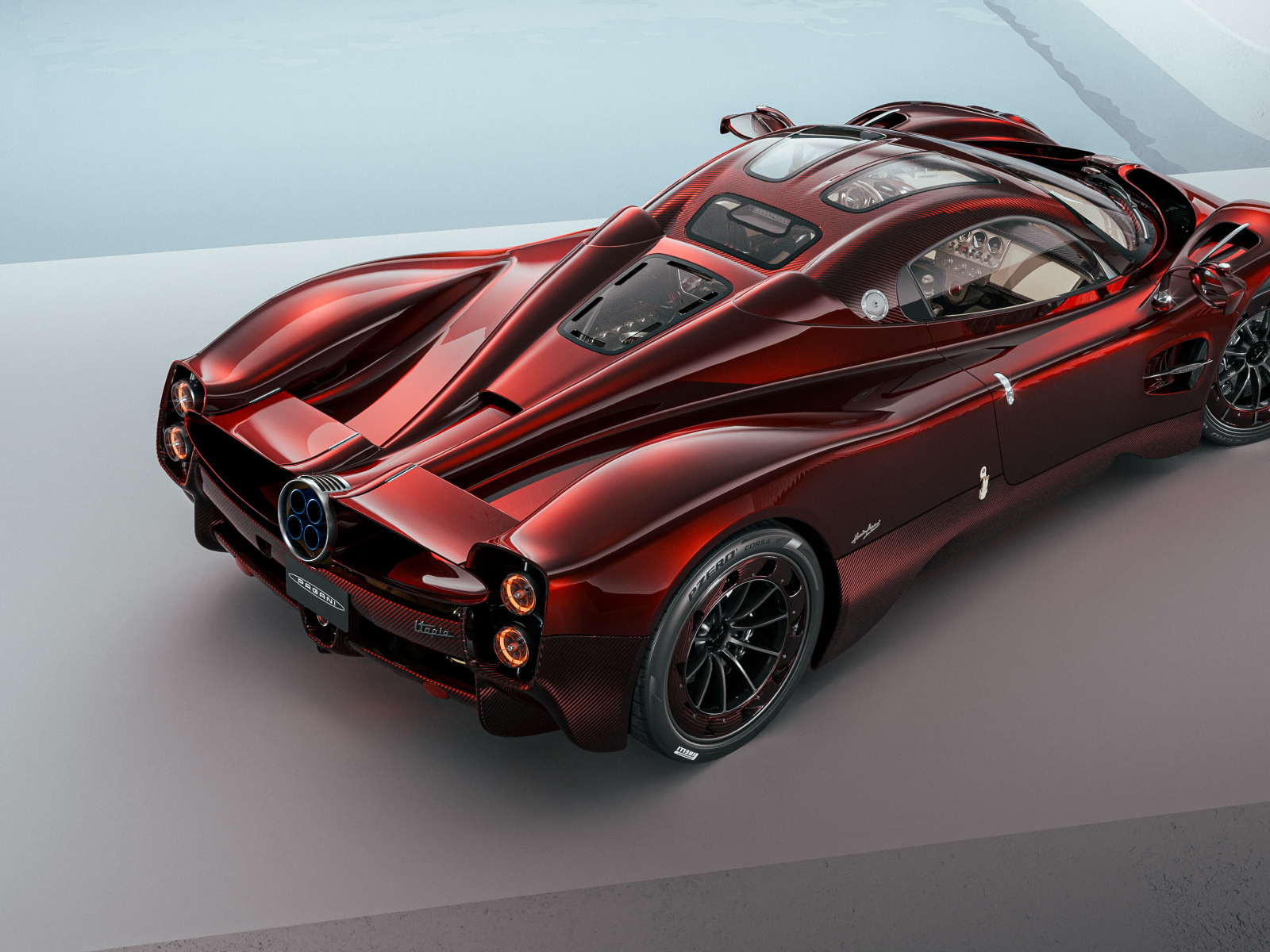 Вид сзади на красный автомобиль Pagani Utopia