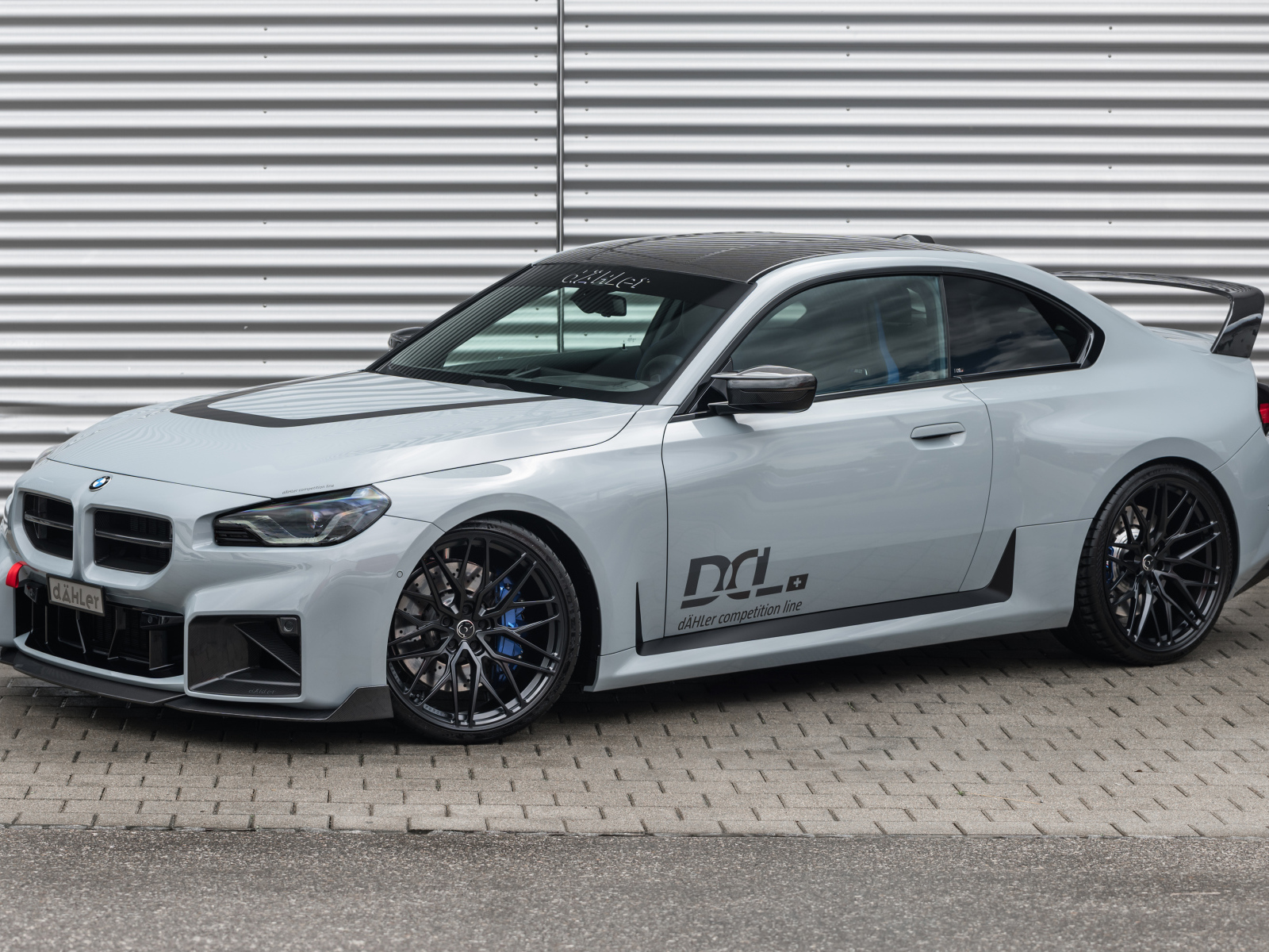 Автомобиль dAHLer BMW M2 Competition line 2024 года у гаража