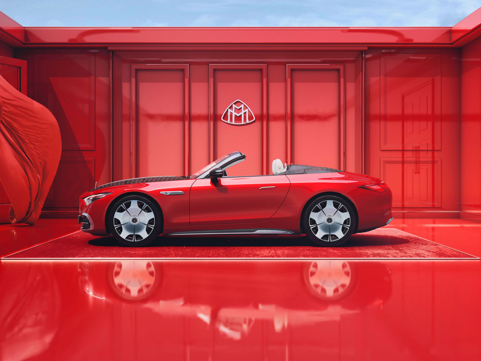 Вид сбоку на красный автомобиль Mercedes-Maybach SL 680 Monogram Series 2024 года