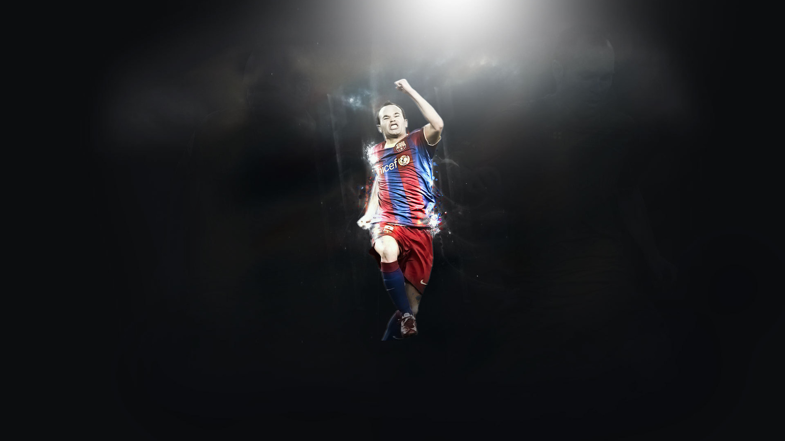 Игрок Барселоны Андрес Иньеста в прыжке