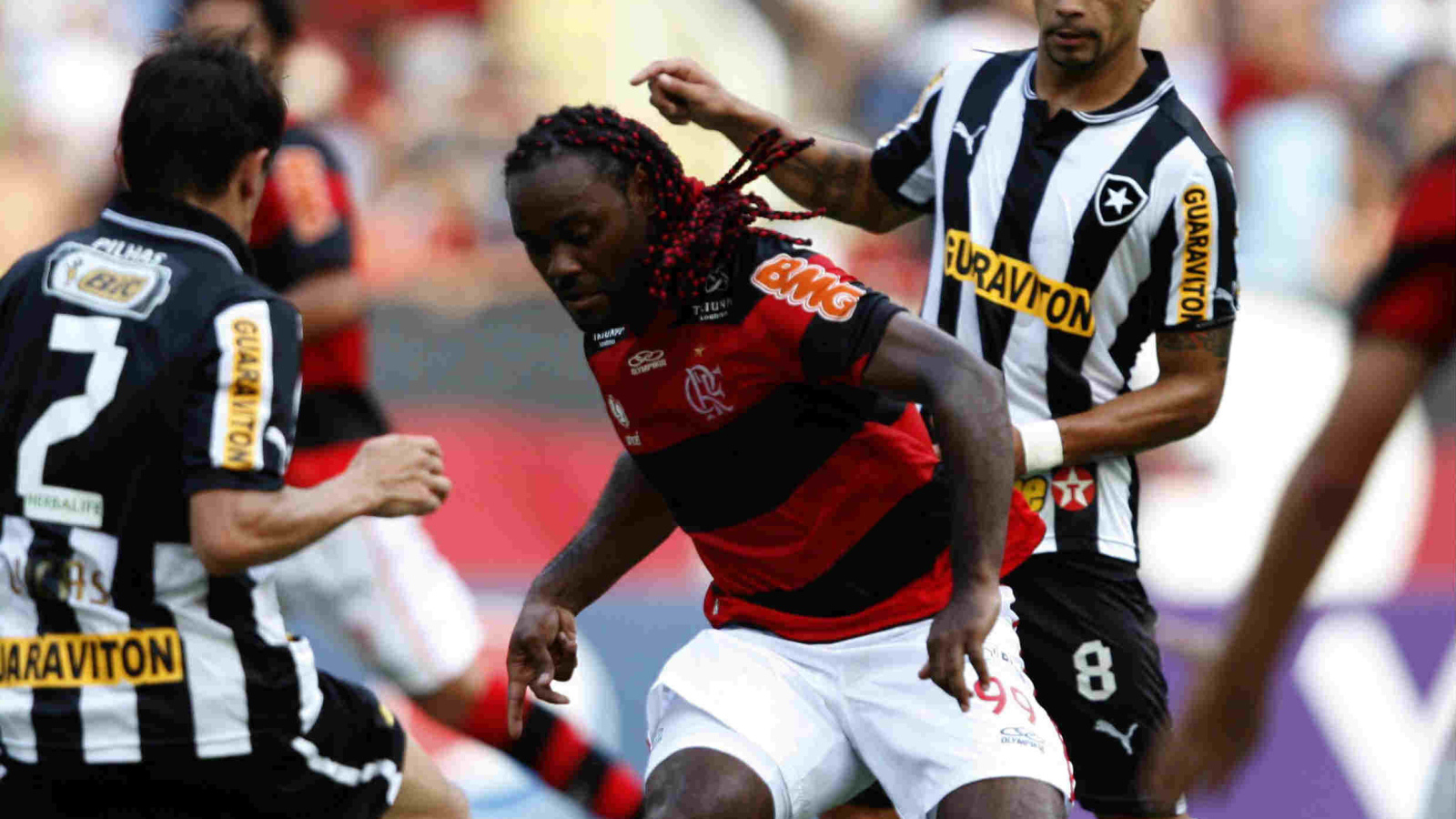 The player of Shandong Luneng Vagner battling for the ball