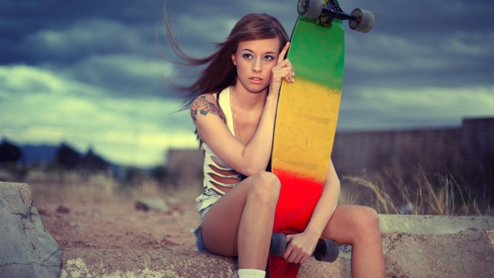 Sporty girl and skateboard
