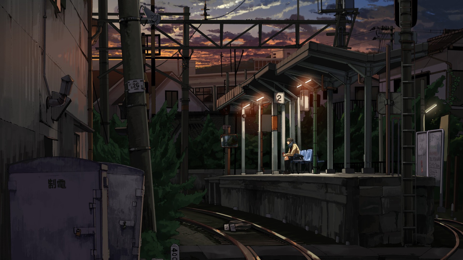 Одинокий парень на железнодорожной станции