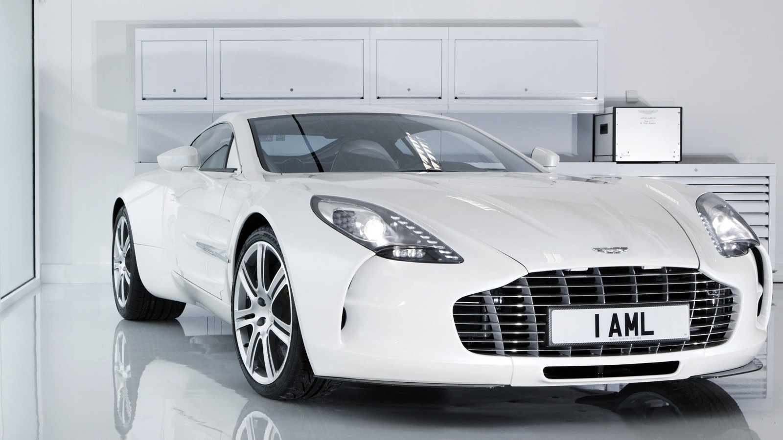 White Aston Martin in a white garage