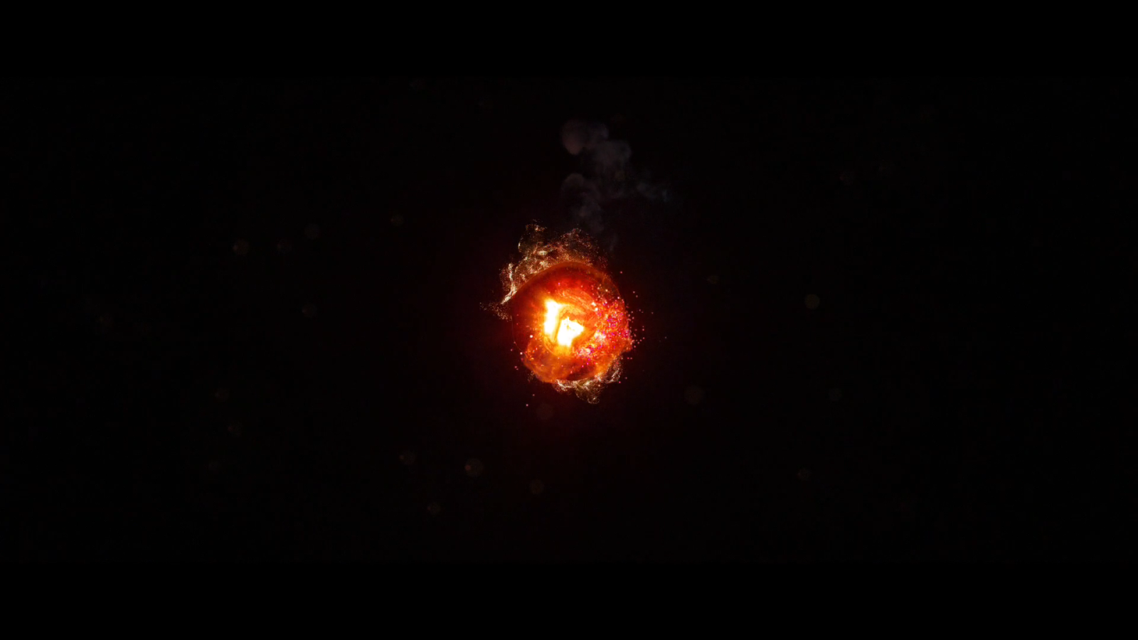 Горящий уголек, черный фон