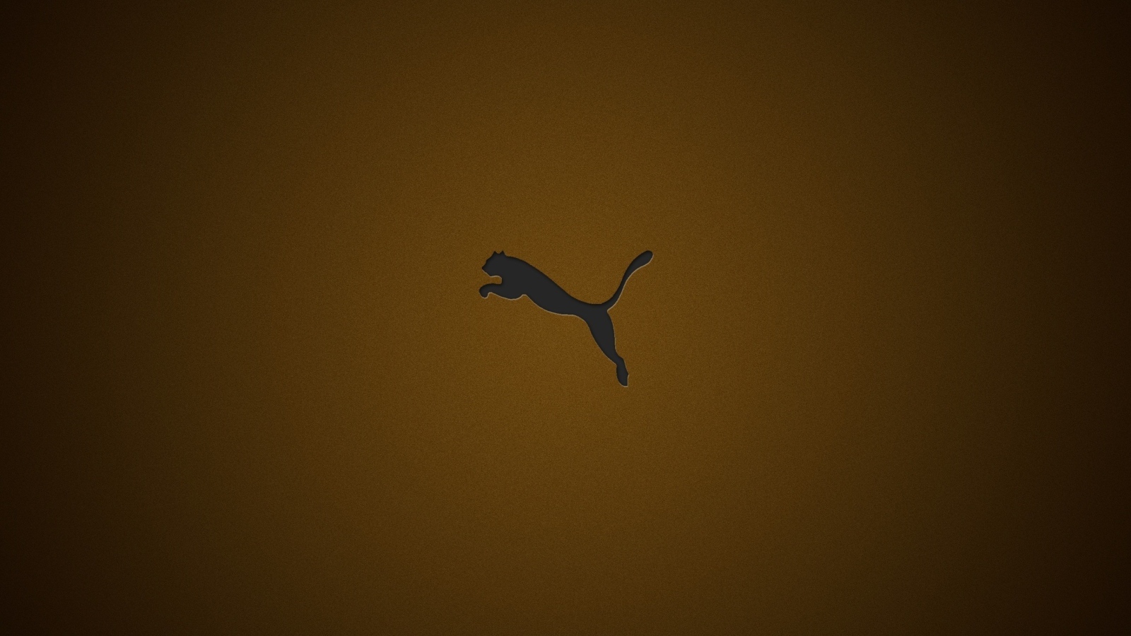 Логотип фирмы Пума на коричневом фоне