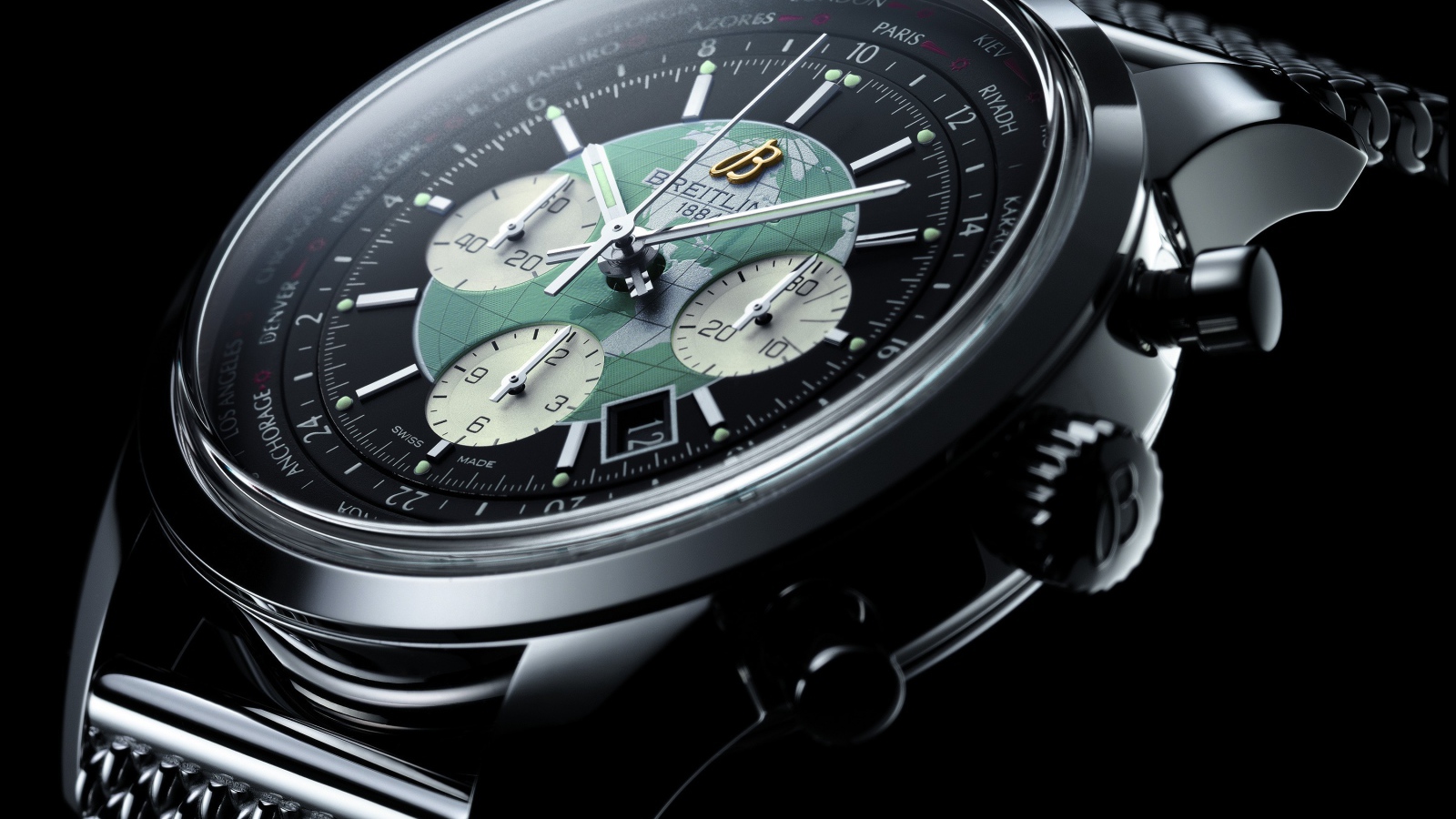 Дорогие наручные часы с картой мира на циферблате