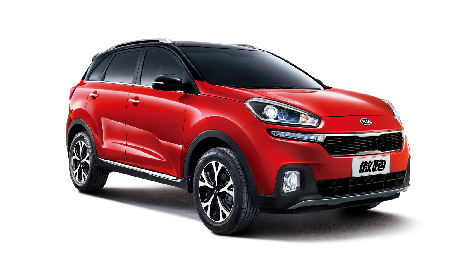 Красный автомобиль кроссовер KIA KX3 на белом фоне