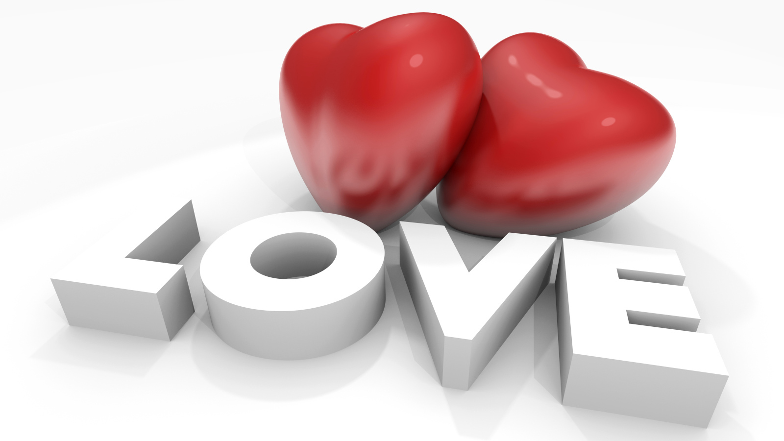 Два больших красных сердца с надписью Любовь на белом фоне, на 14 февраля